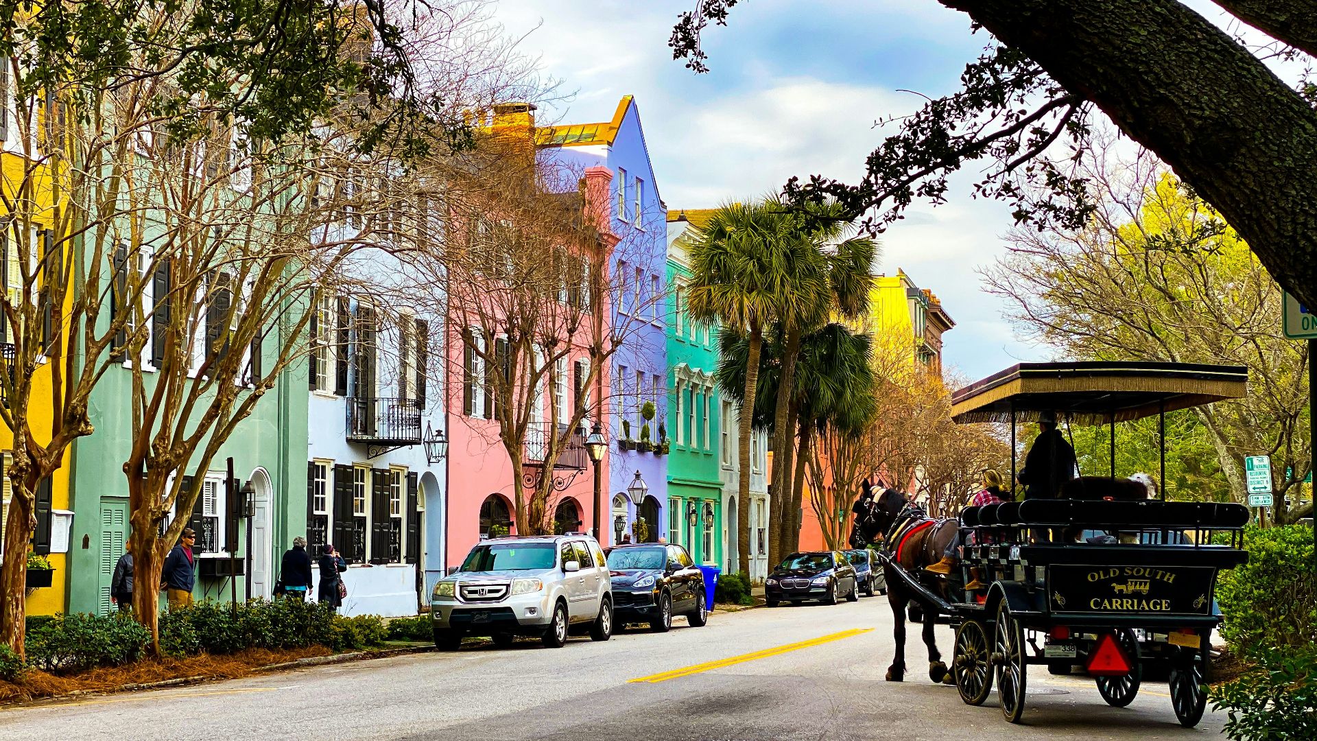 people riding on carriage on road during daytime