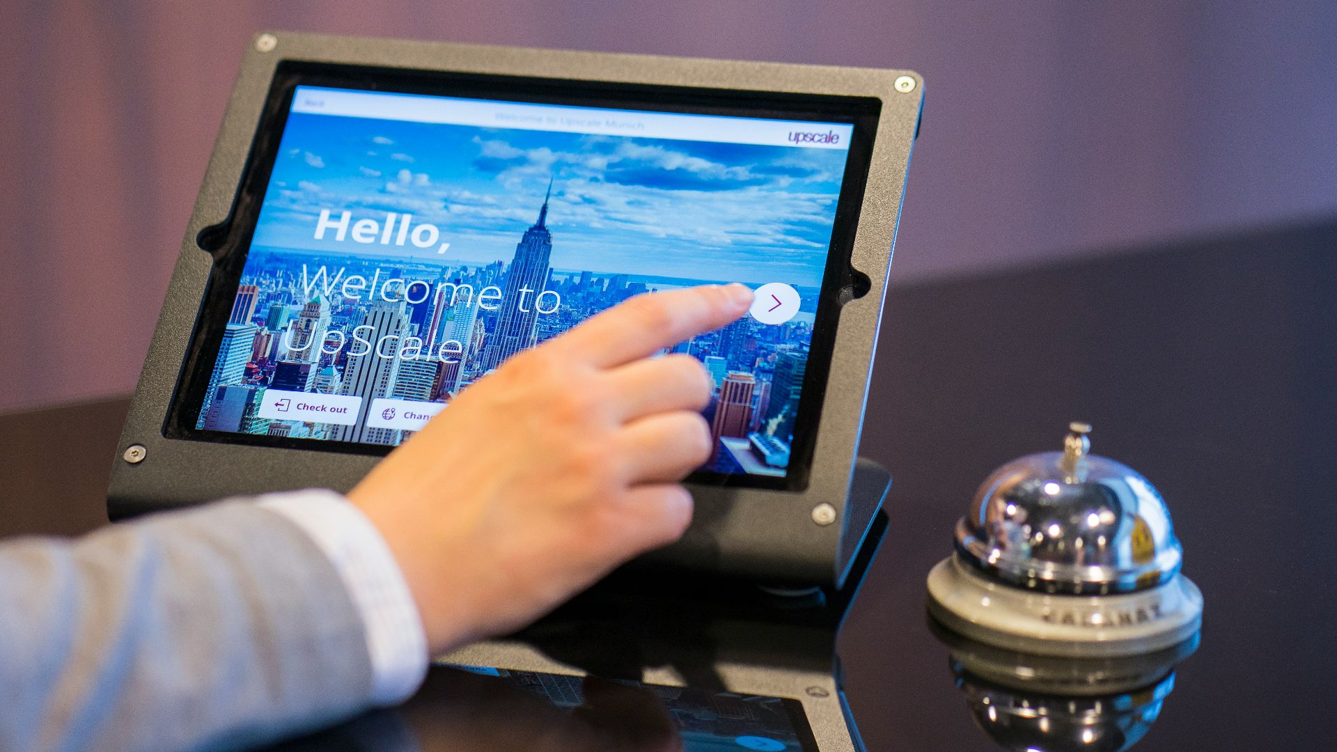 person about to touch black Android tablet computer