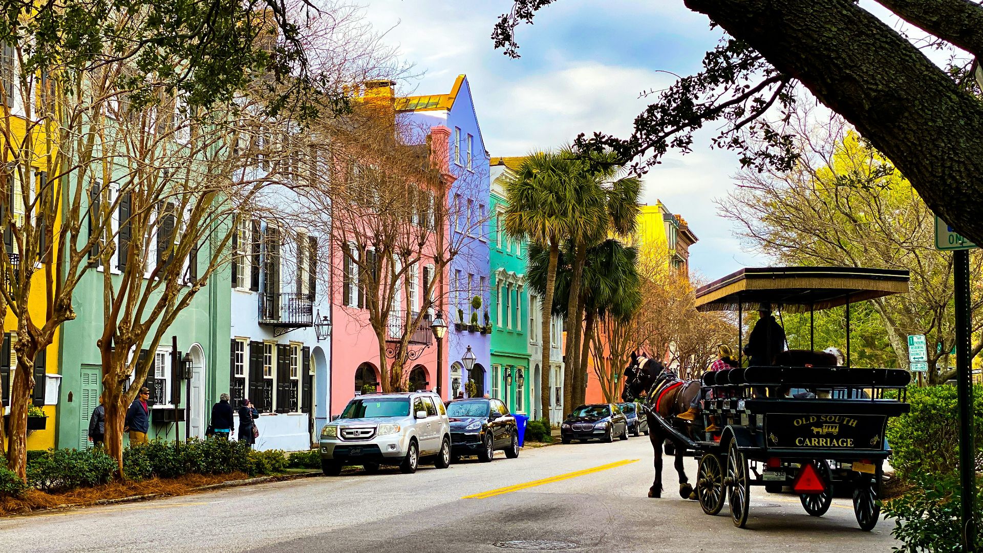 people riding on carriage on road during daytime