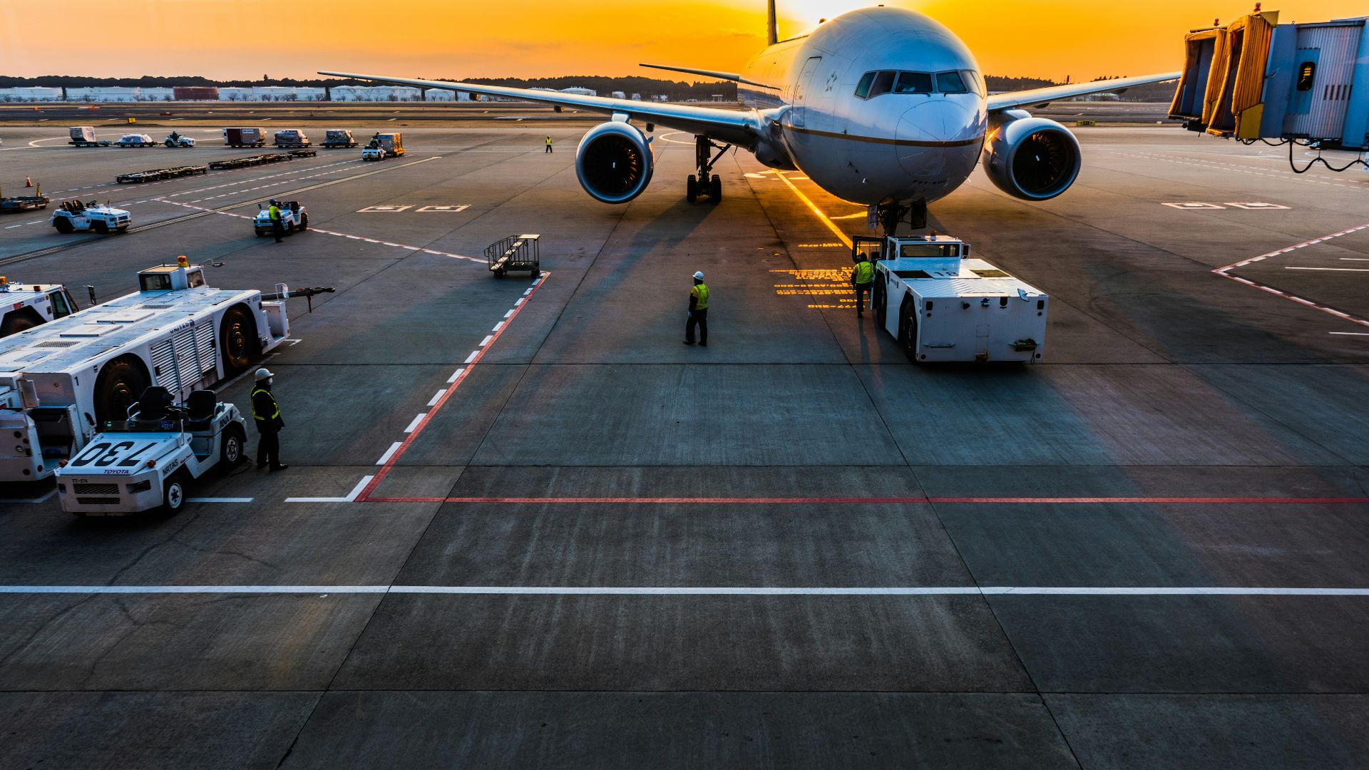 gray airplane on parking