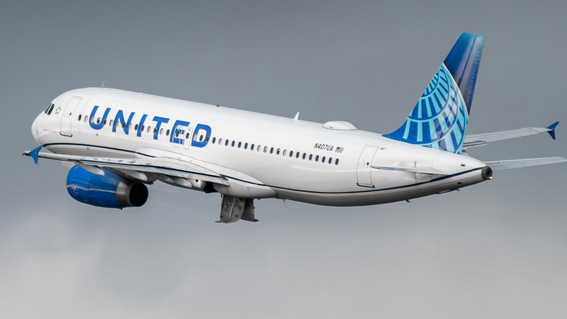 a united airlines plane flying in the sky