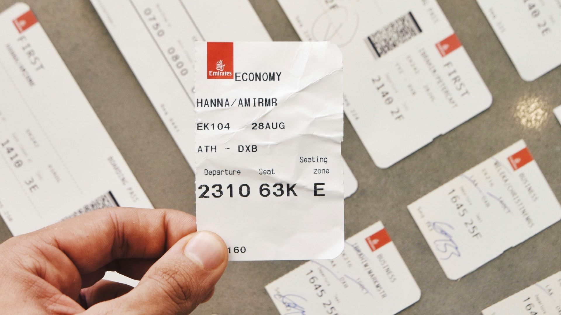 person holding white card