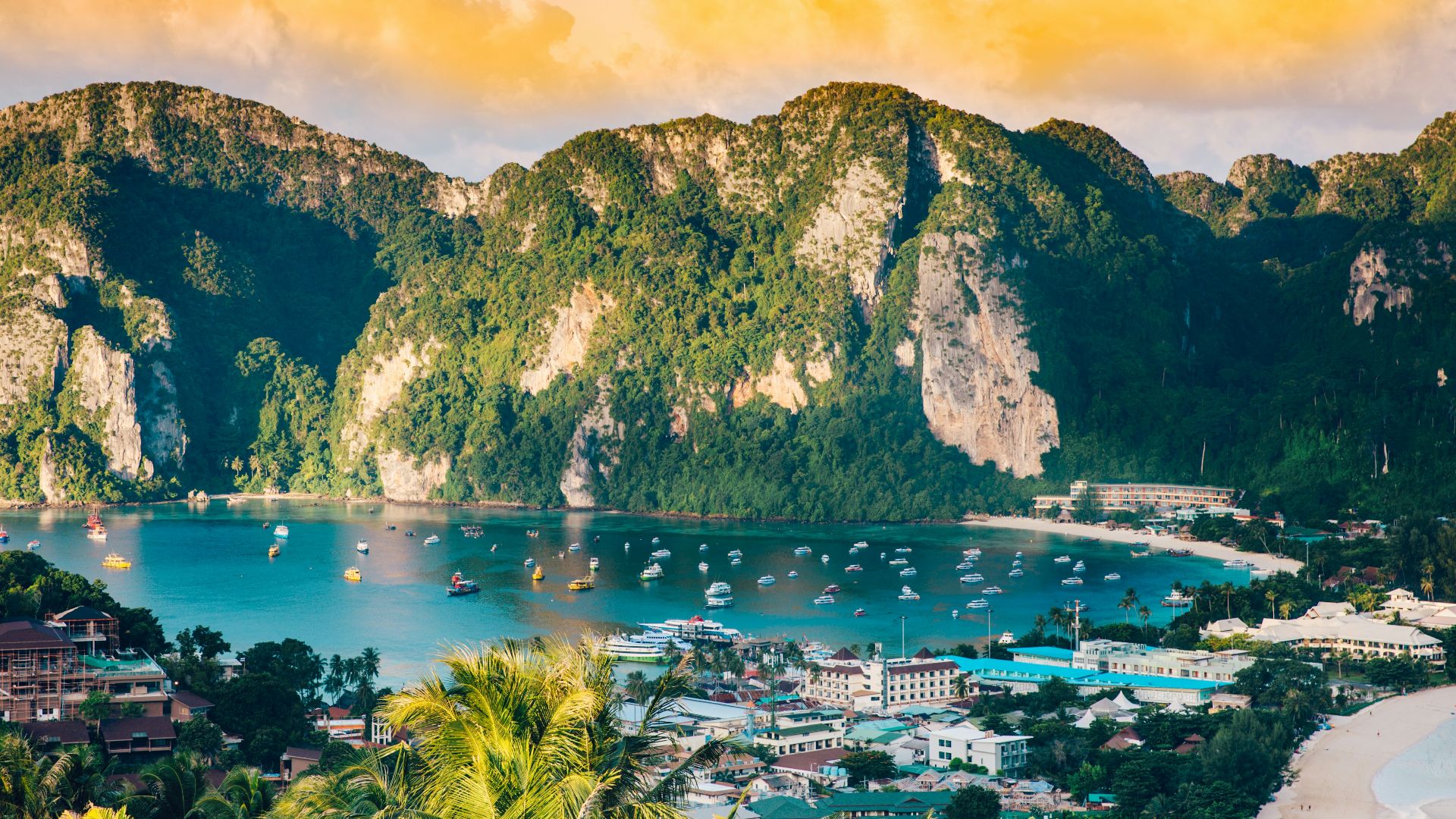 aerial photography of body of water surrounded with mountains