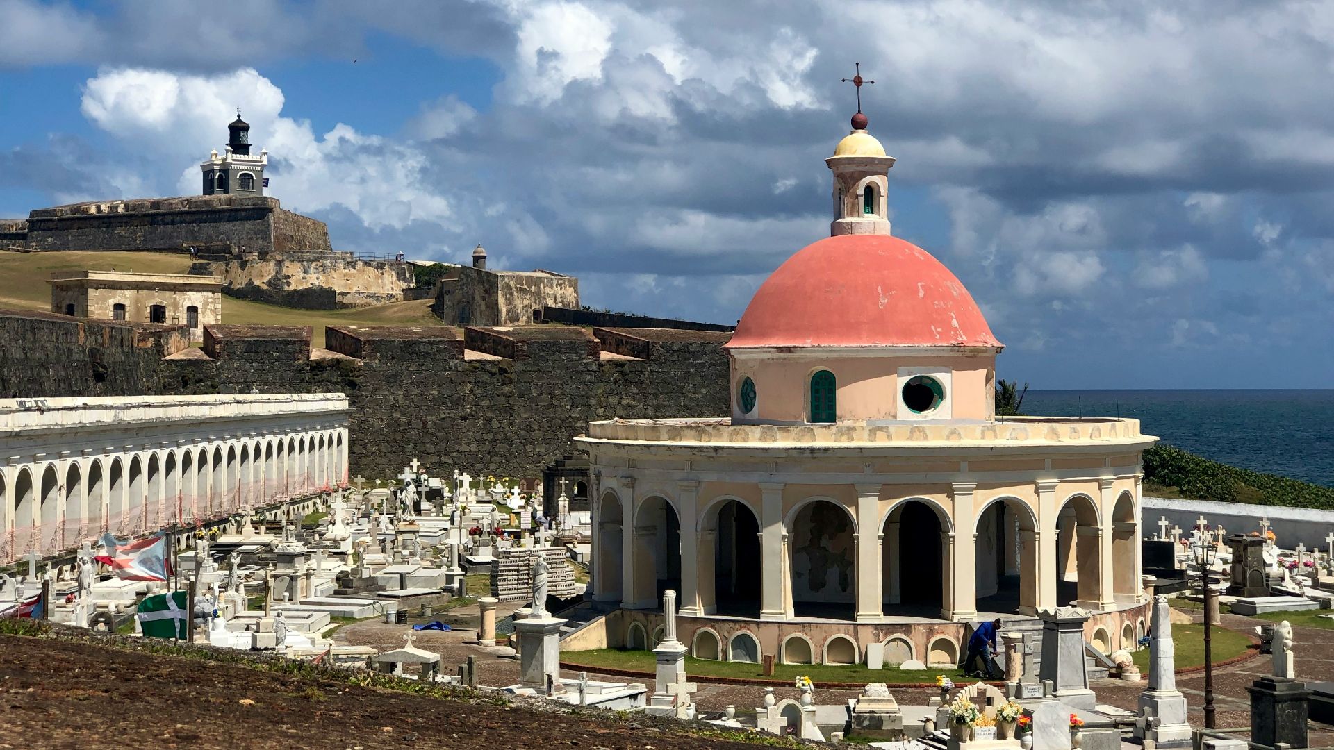 a large building with a red dome on top of it