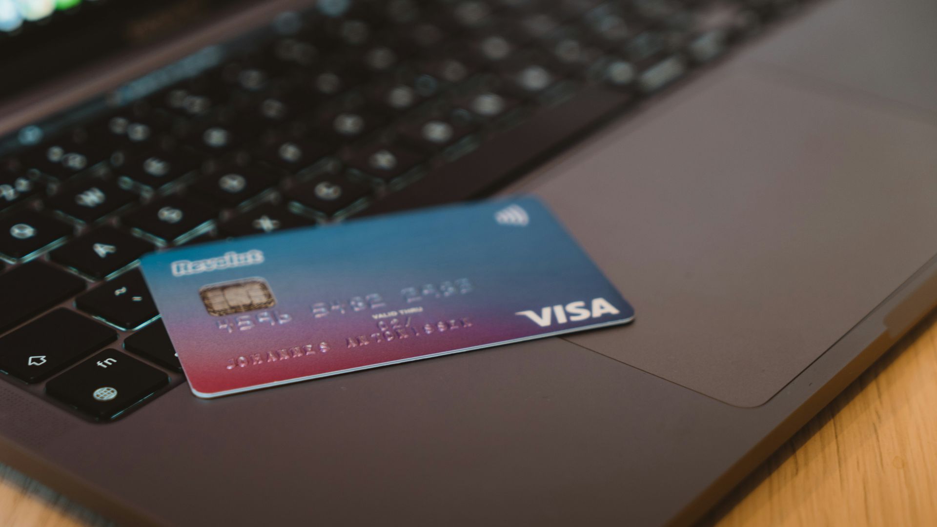 blue and white visa card on silver laptop computer