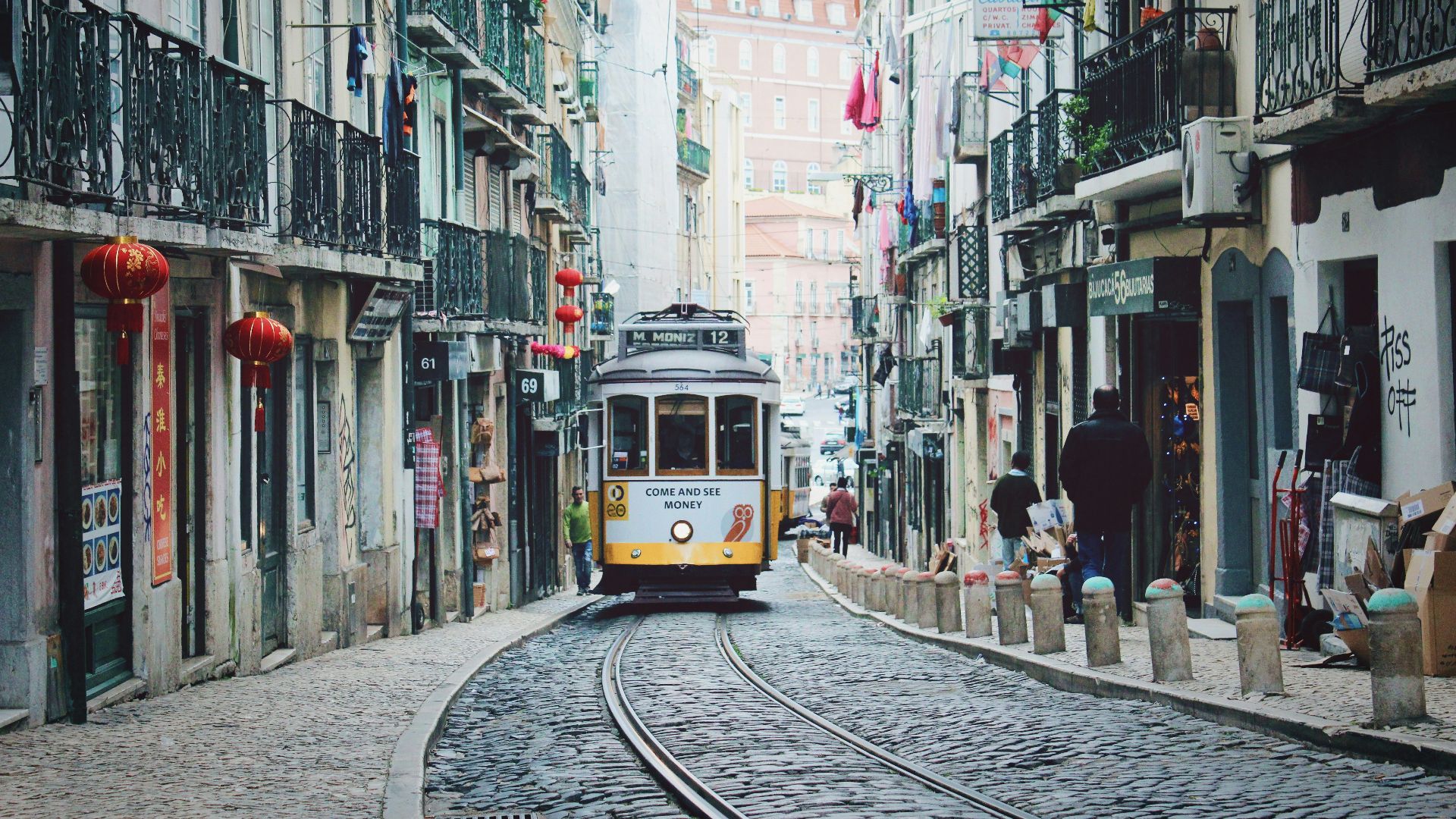 train passing in between buildings