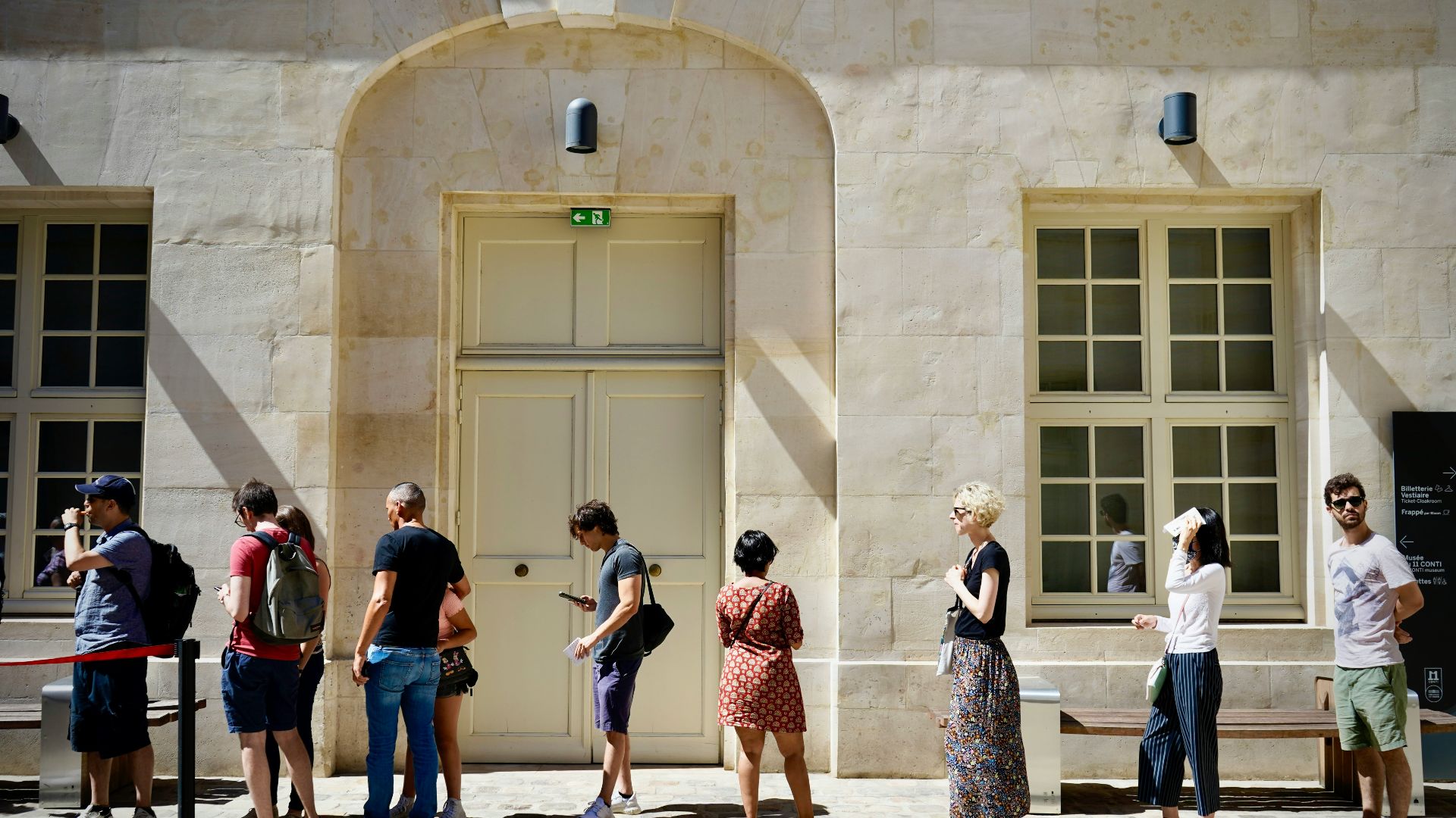 a group of people standing outside a building