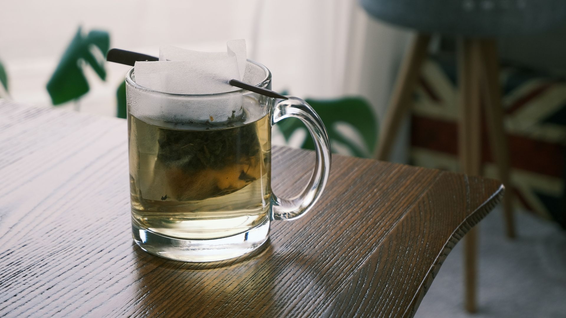 clear glass mug on brown wooden table