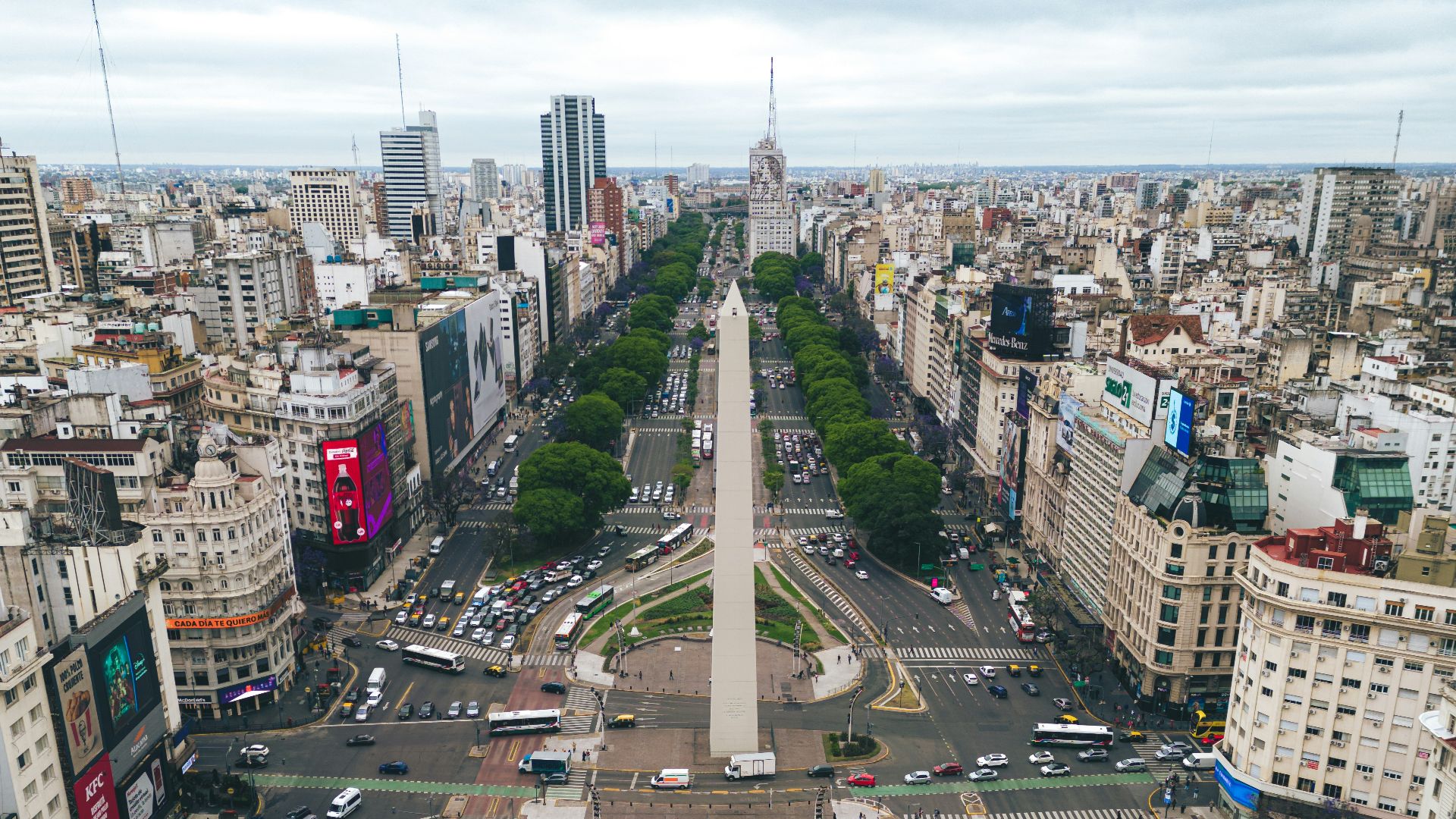 an aerial view of a city with a monument in the middle