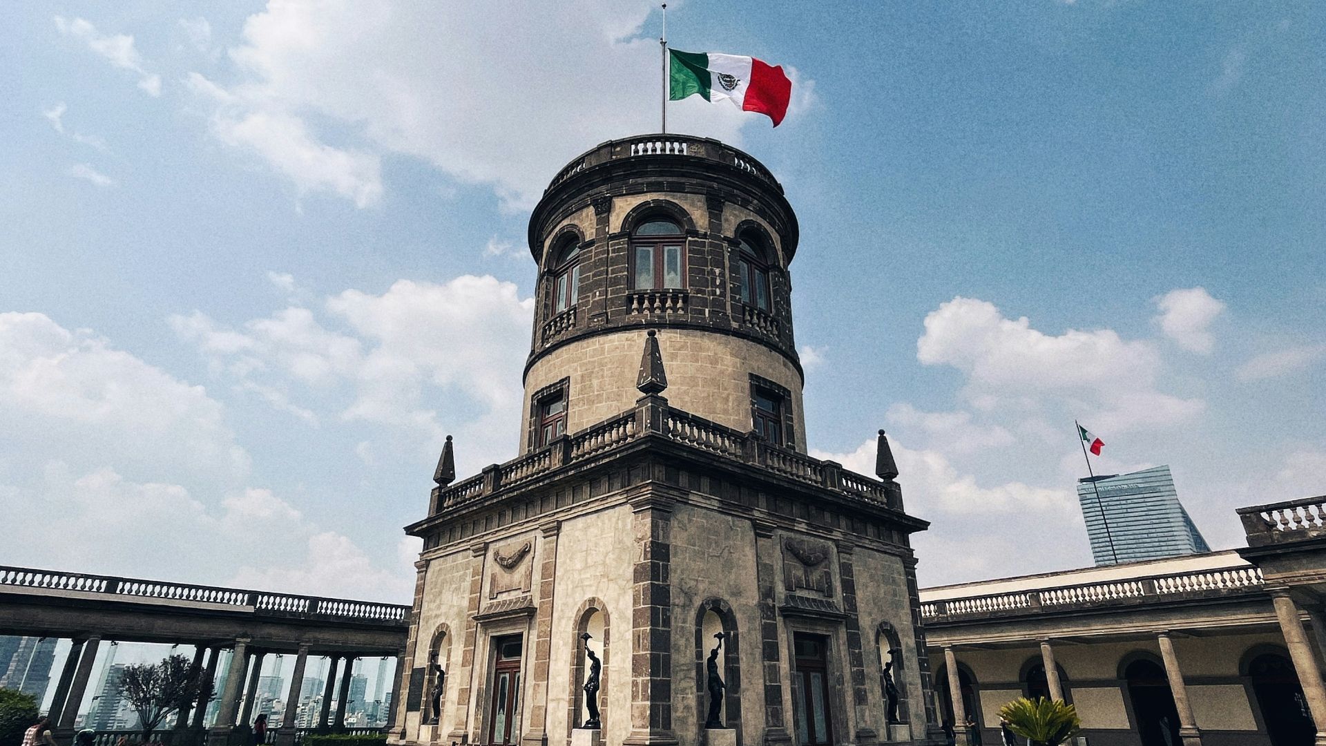 a large building with a flag on top of it