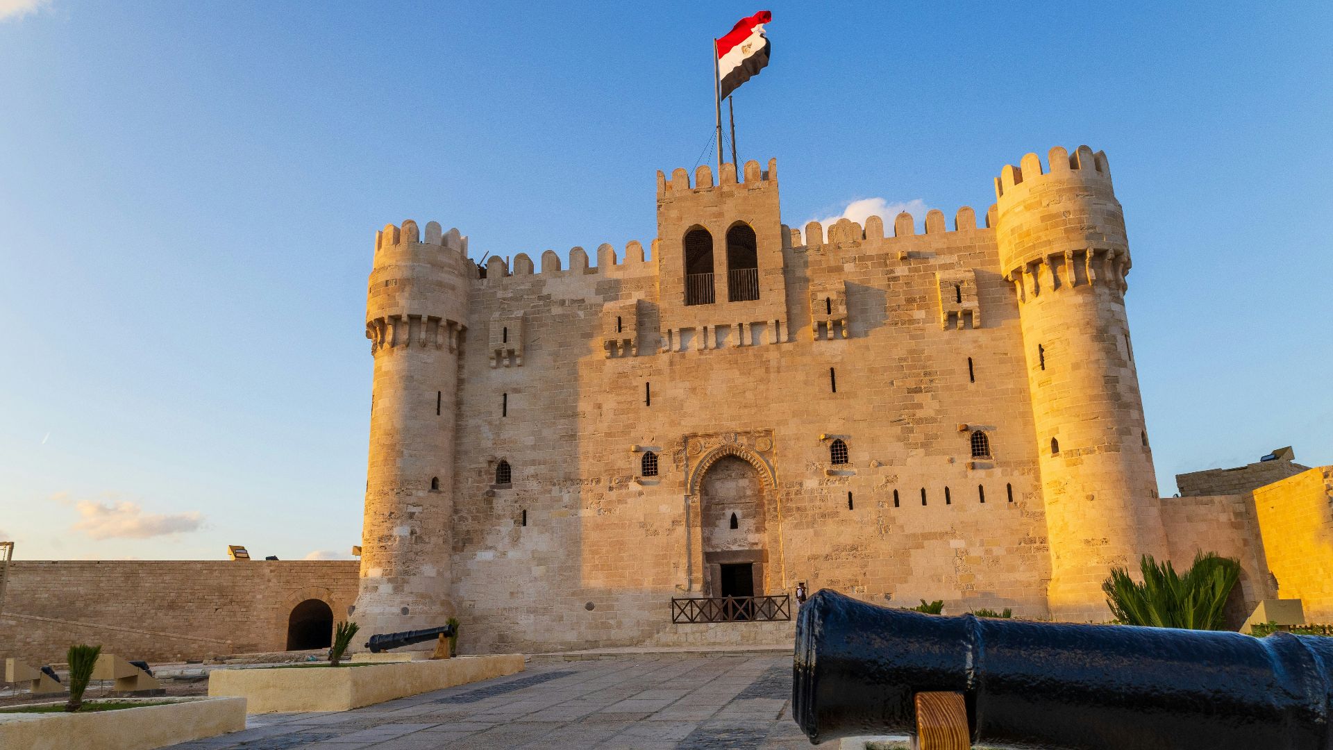 A large castle with a flag on top of it