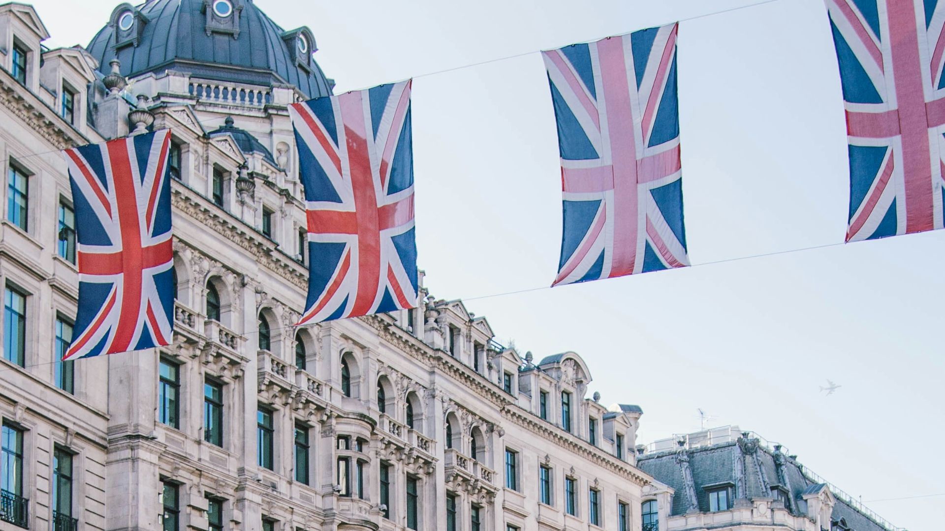 photo of car and bus near castle