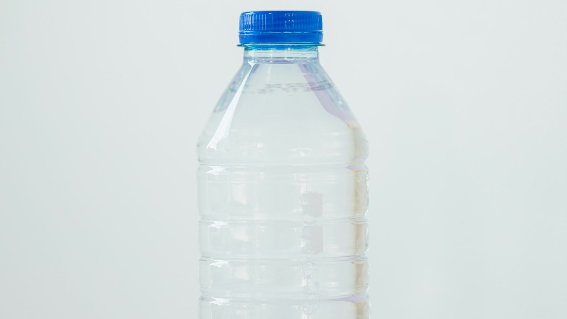 clear plastic bottle on white table