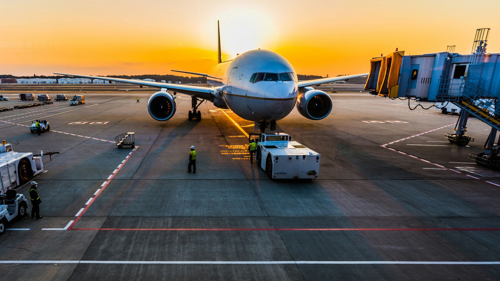 gray airplane on parking