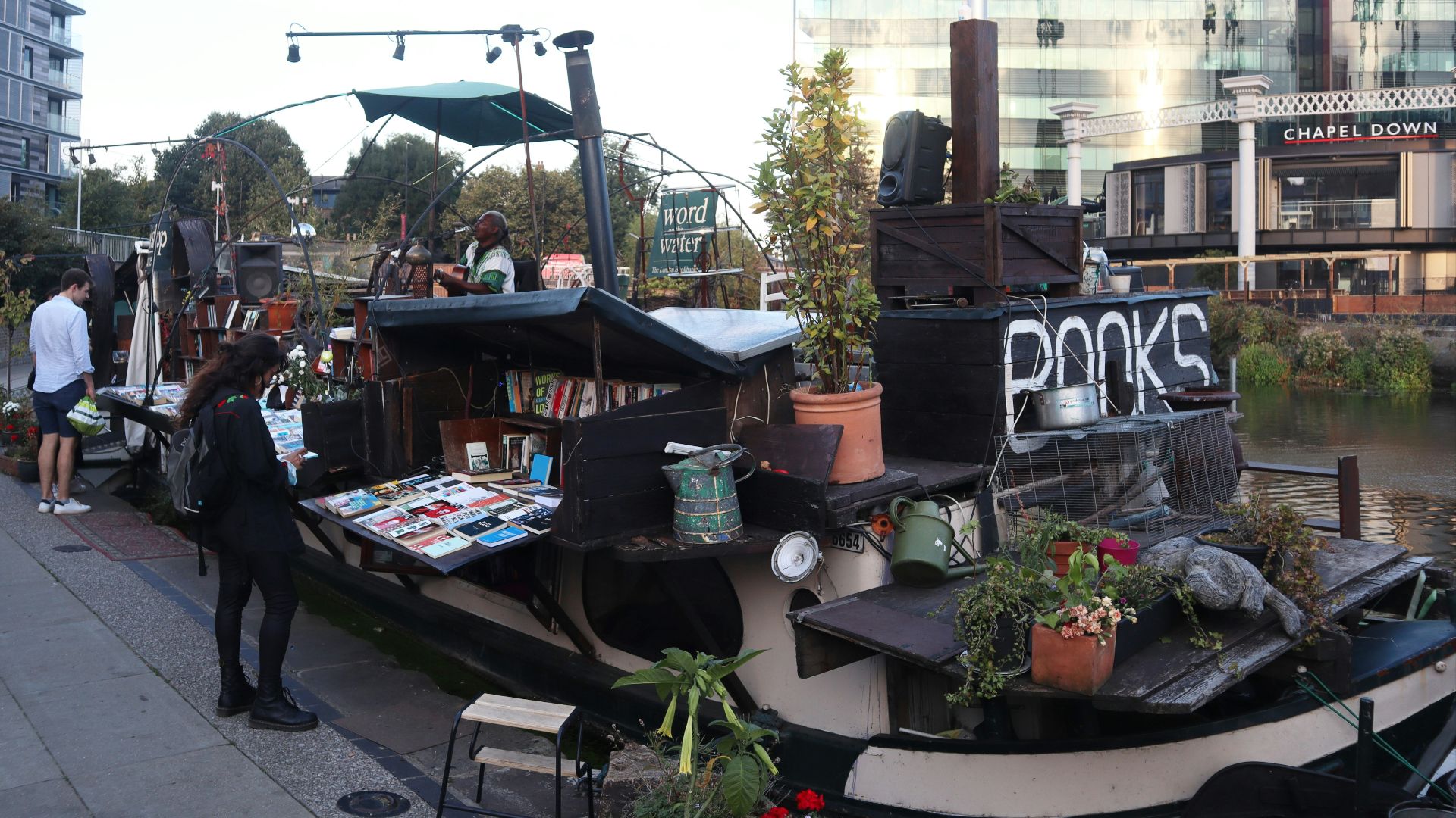 people walking on sidewalk near building during daytime