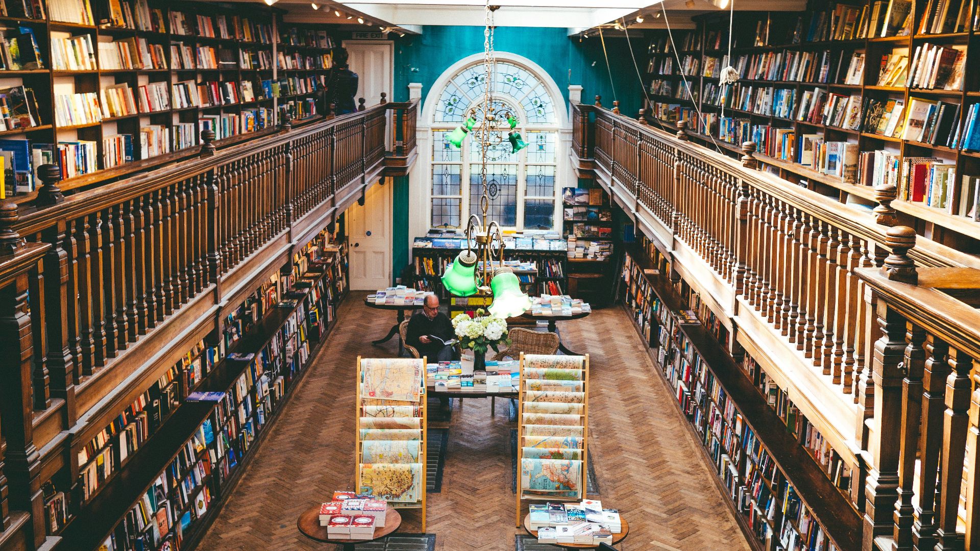 books arranged on shelves inside library