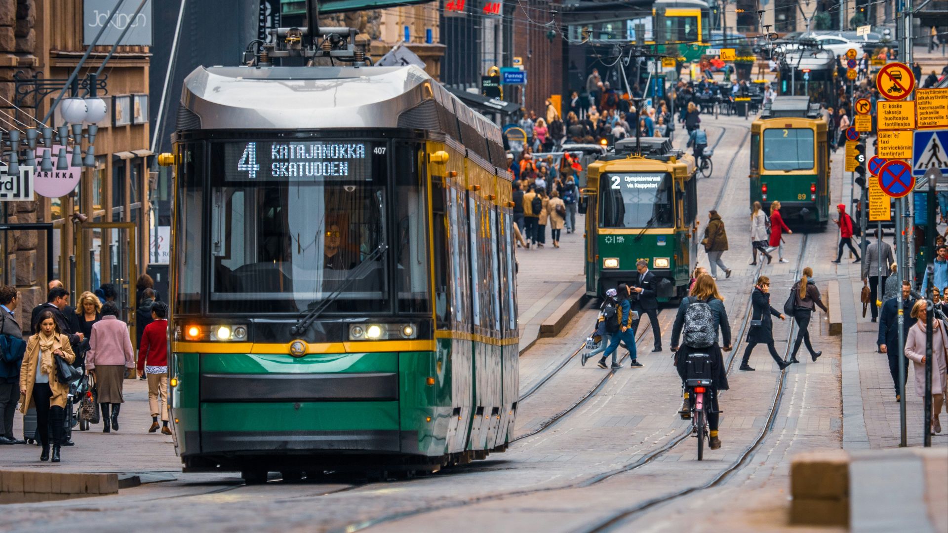 green and yellow city tram