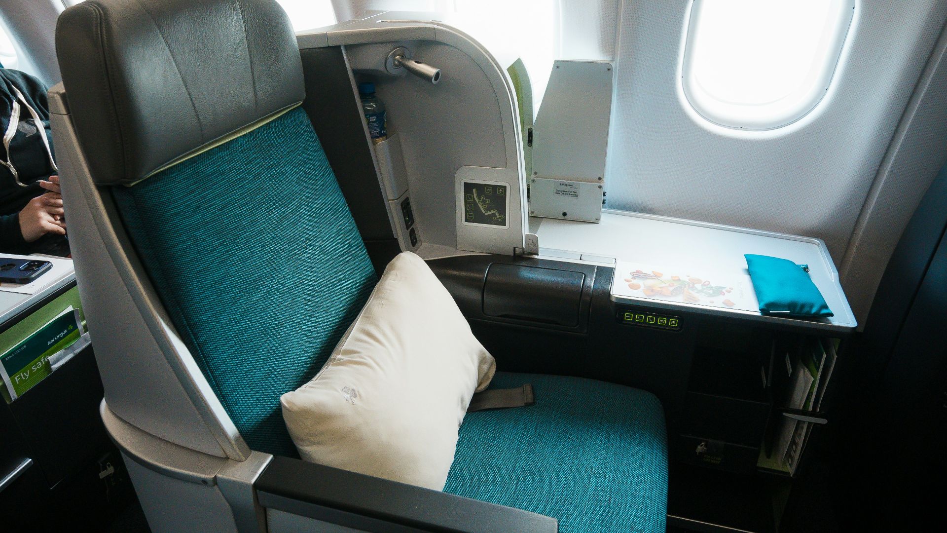 a seat on an airplane with a pillow on it