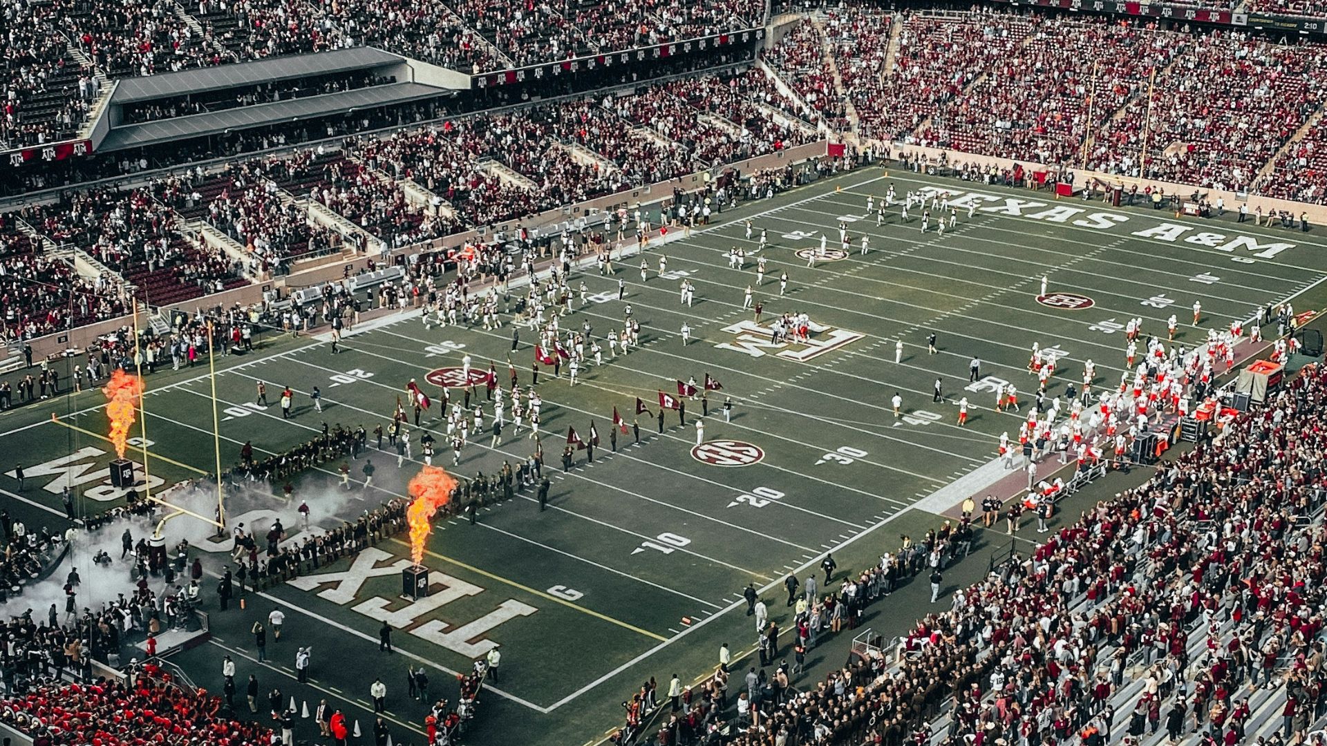 people watching soccer game during daytime