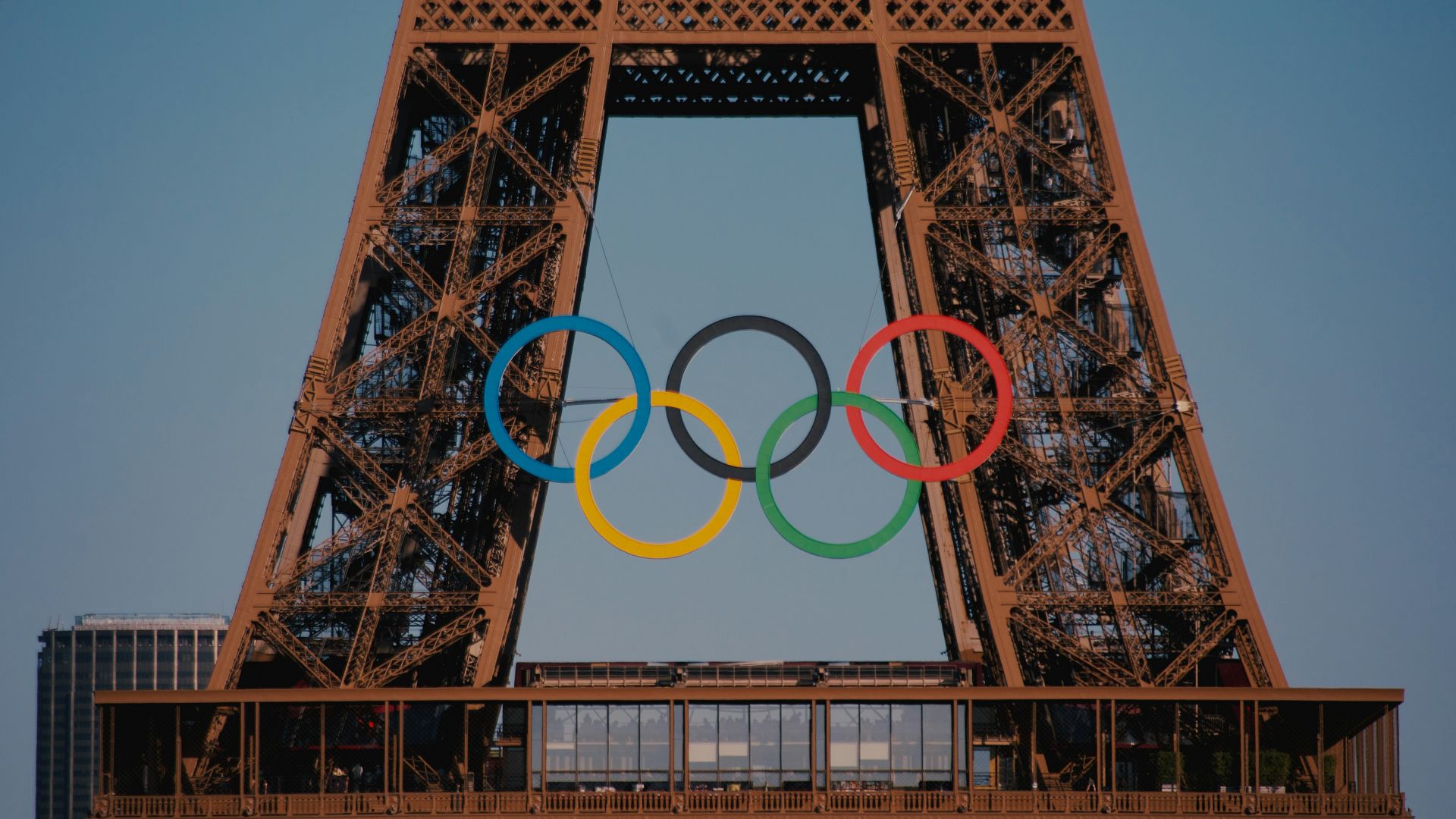 The eiffel tower with the olympic rings in front of it