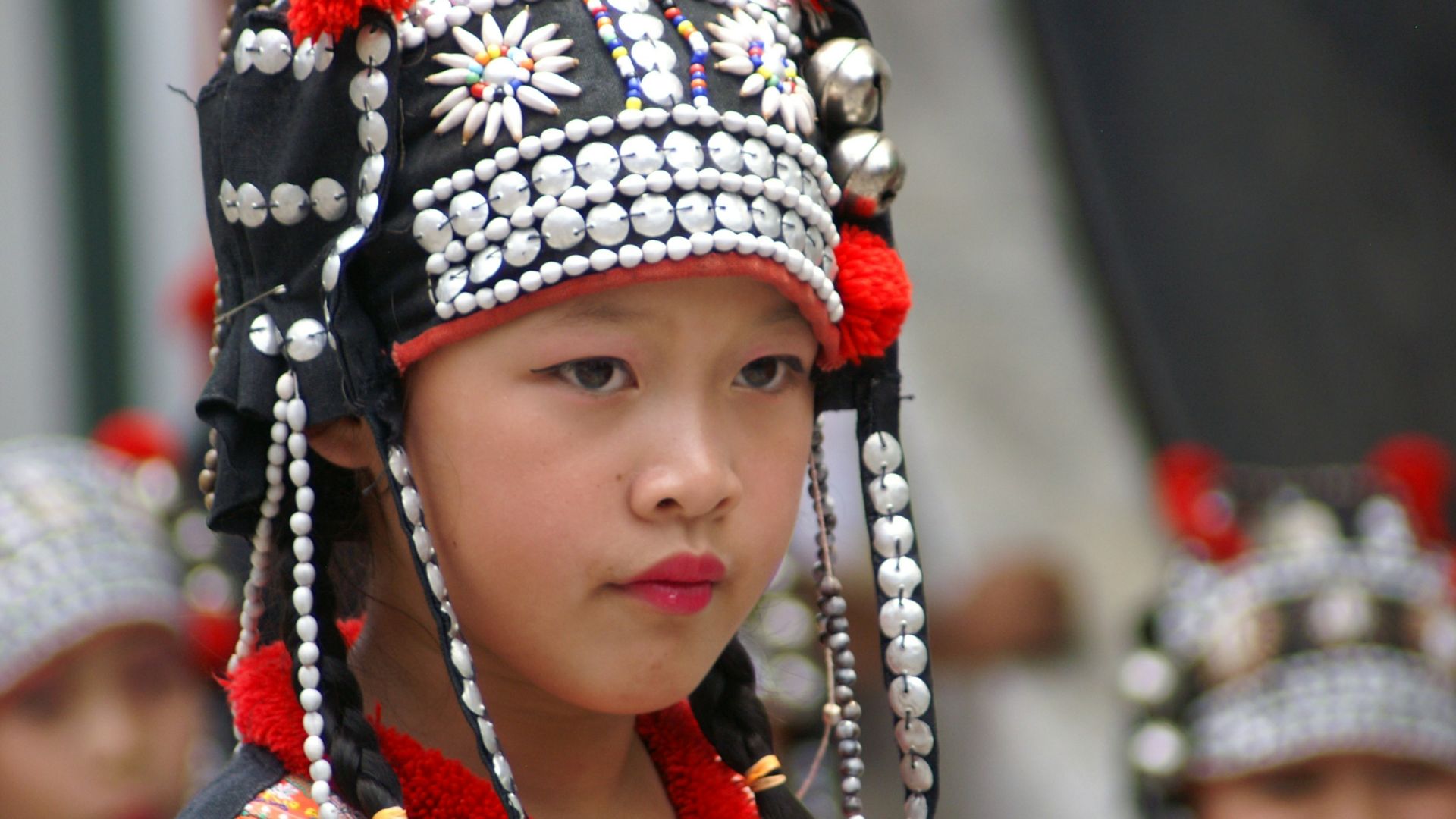 girl in red and black floral headdress