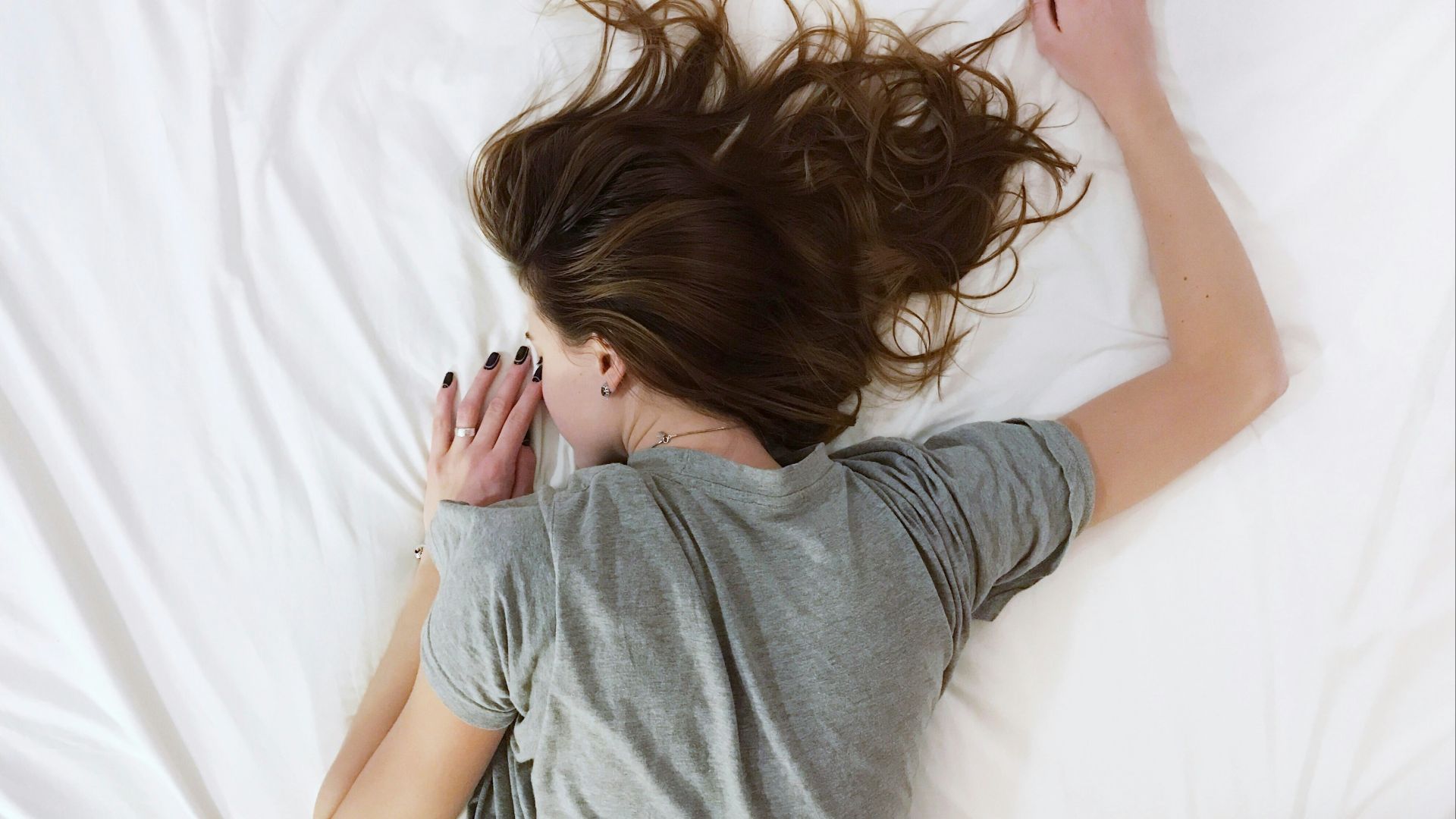 woman laying on bed
