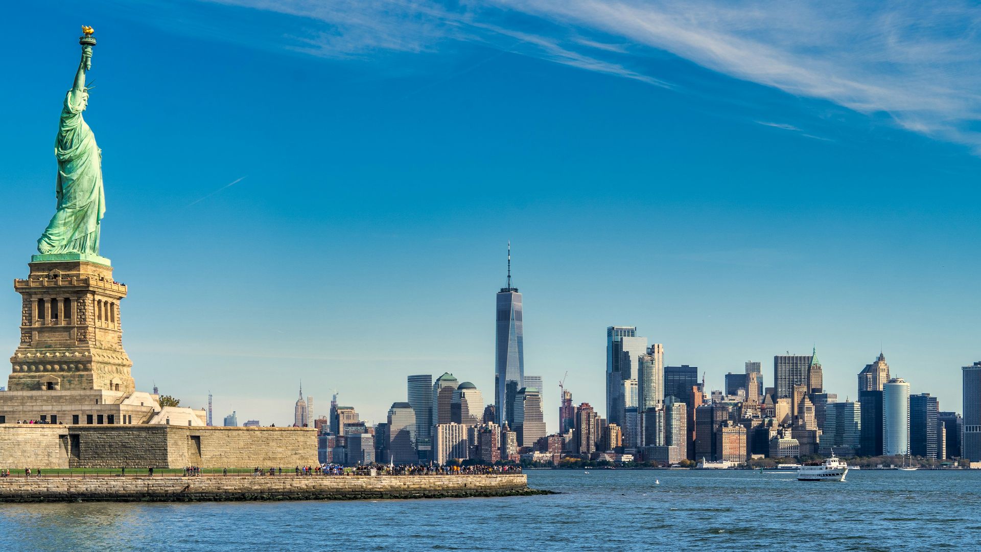 city skyline across body of water during daytime