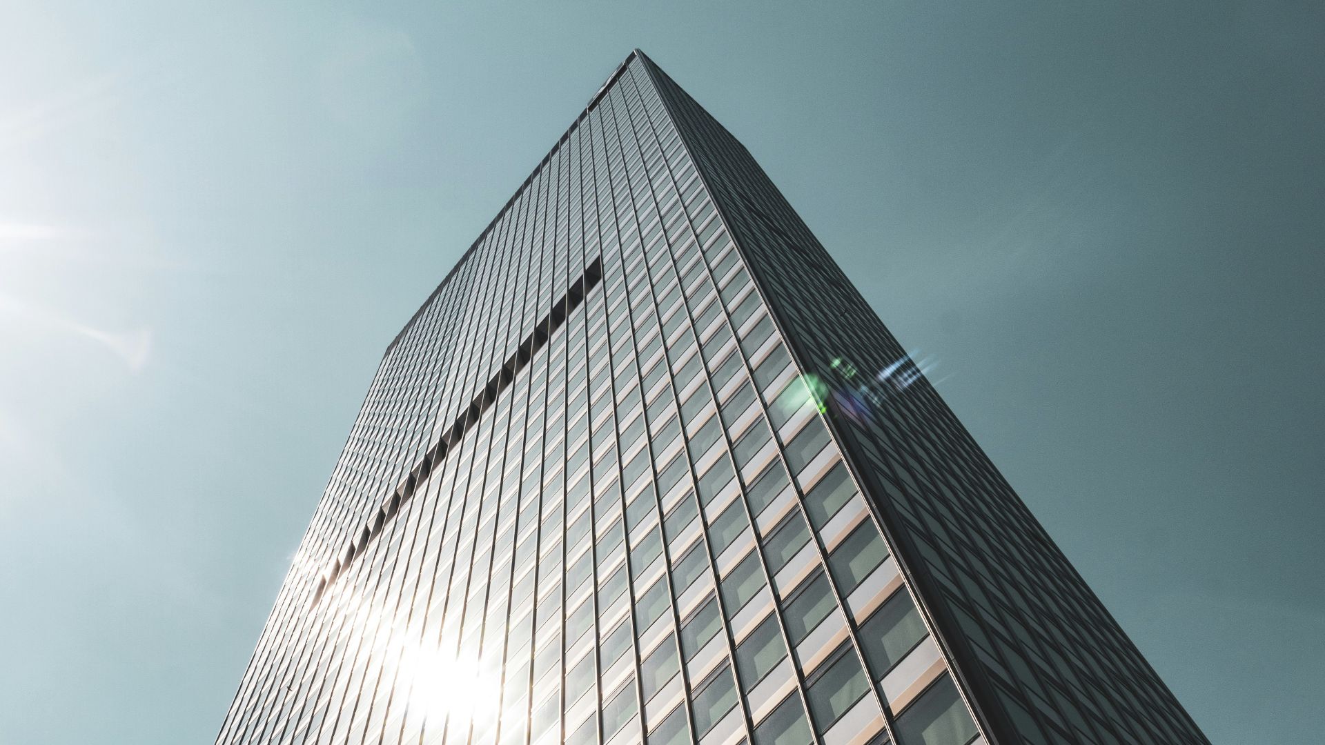 black and white building under gray sky