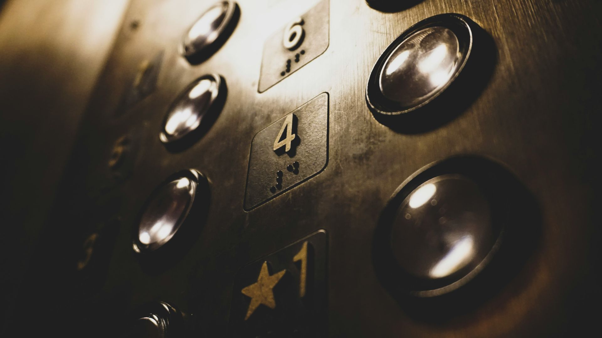 close-up photo of elevator push buttons
