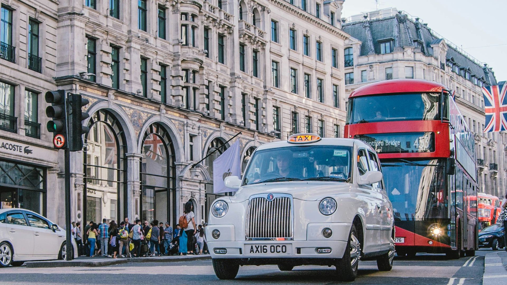 photo of car and bus near castle