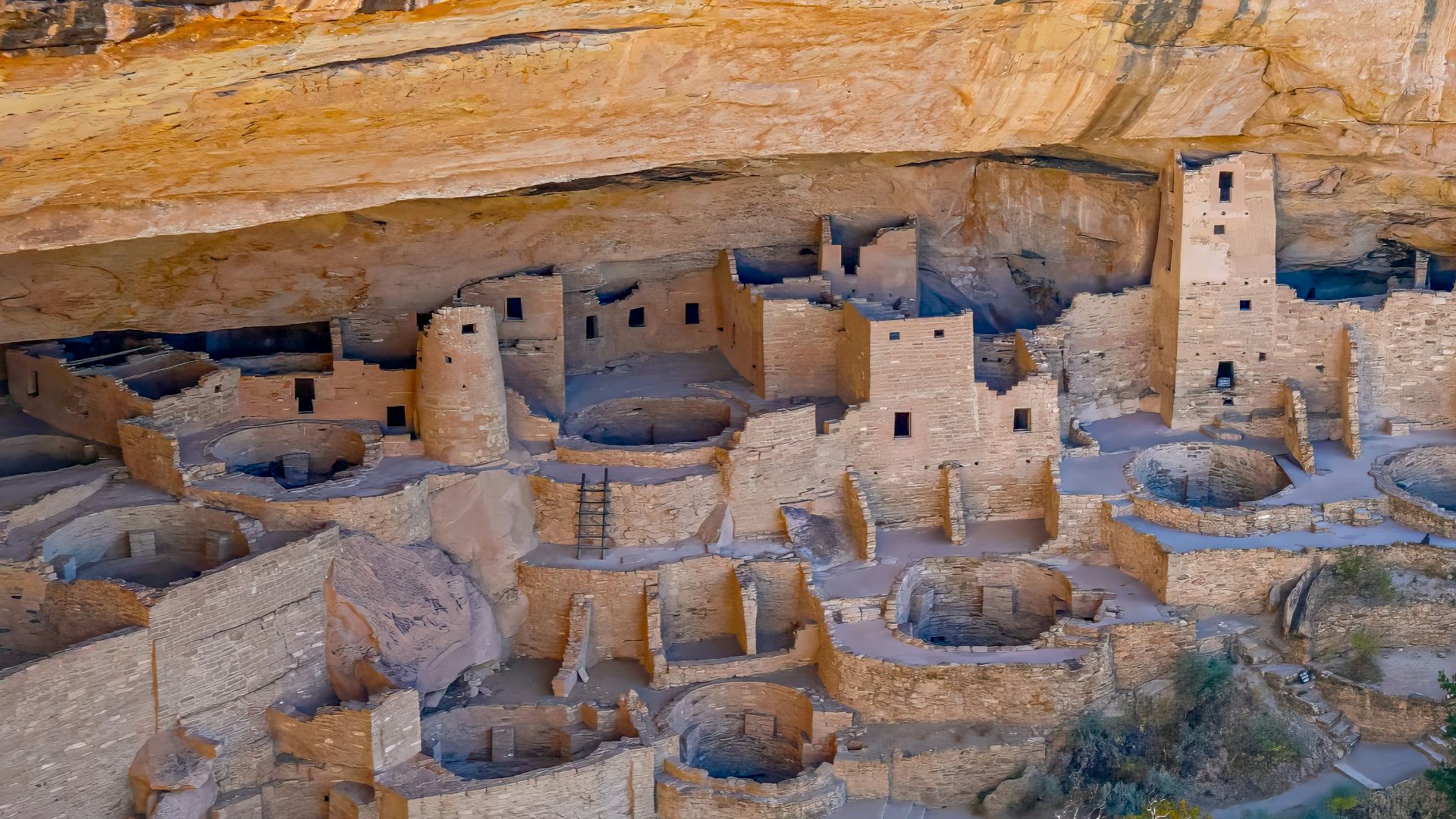 an aerial view of a cliff dwelling in a canyon