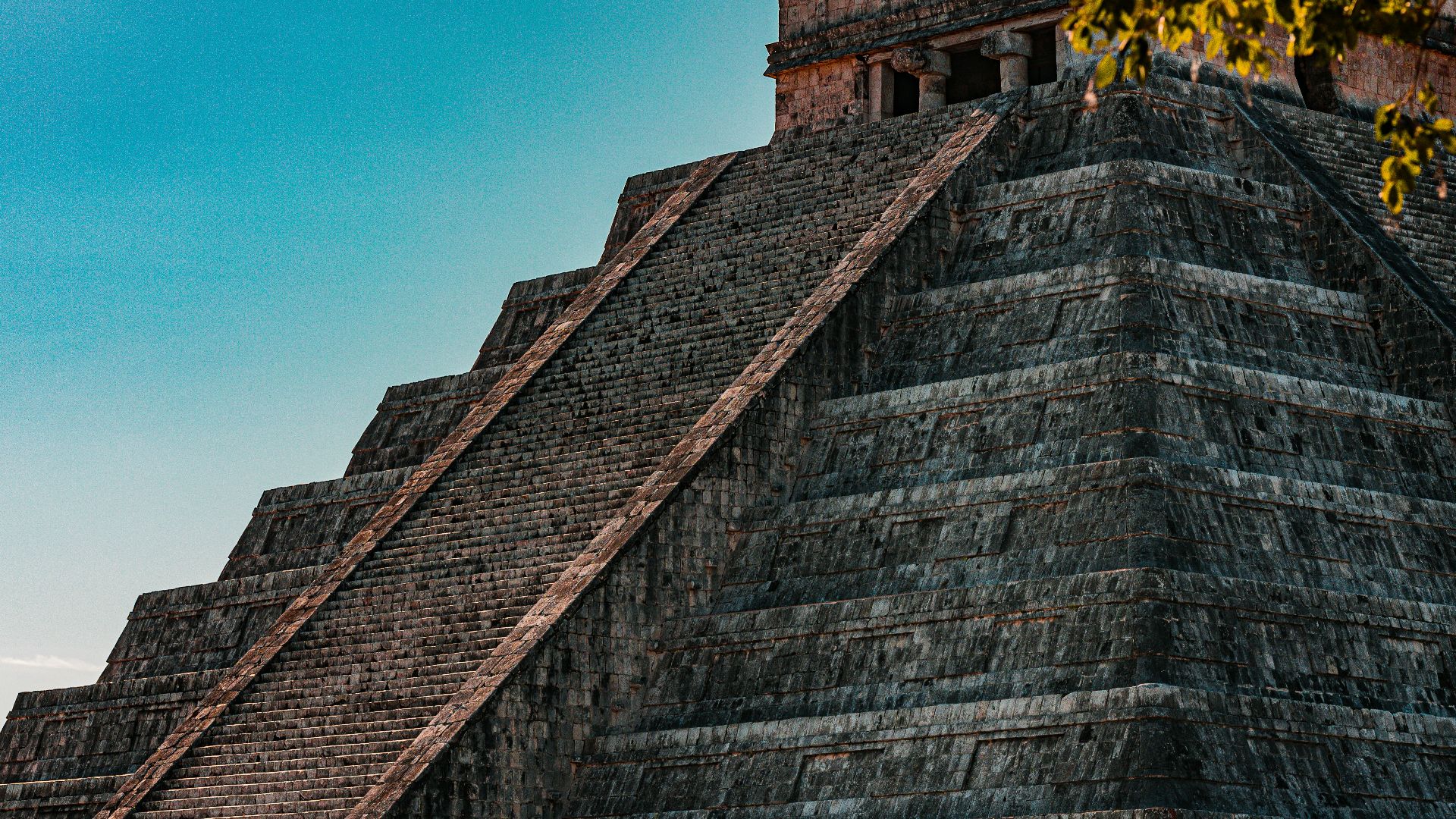 a large pyramid with a clock on top of it