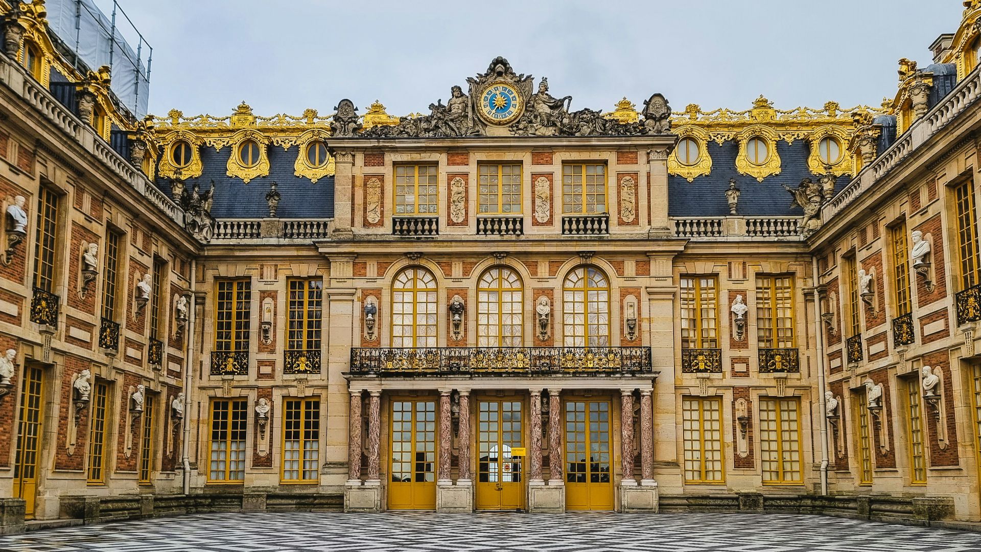 a large building with a checkered floor in front of it