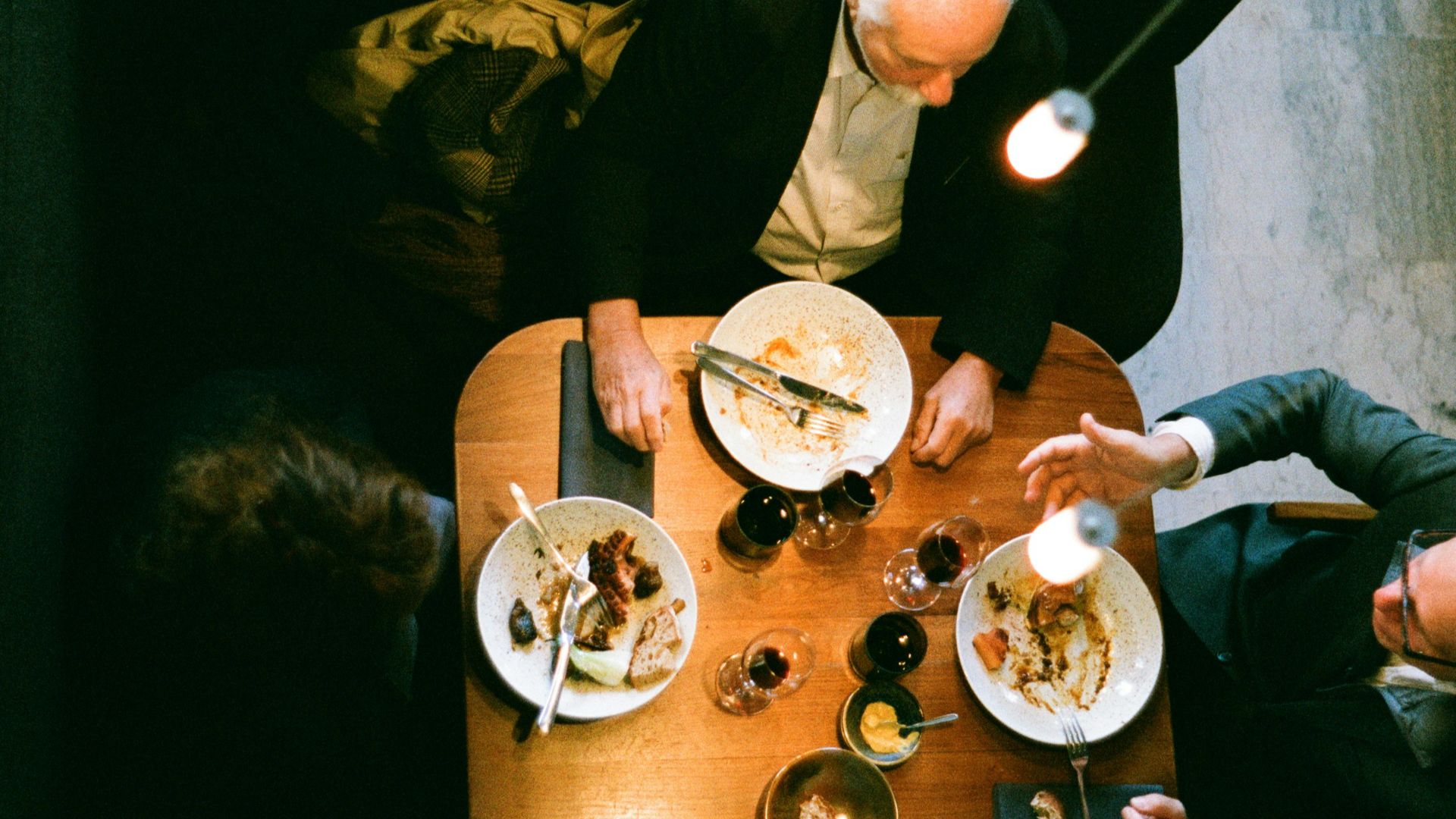people sitting at the table eating