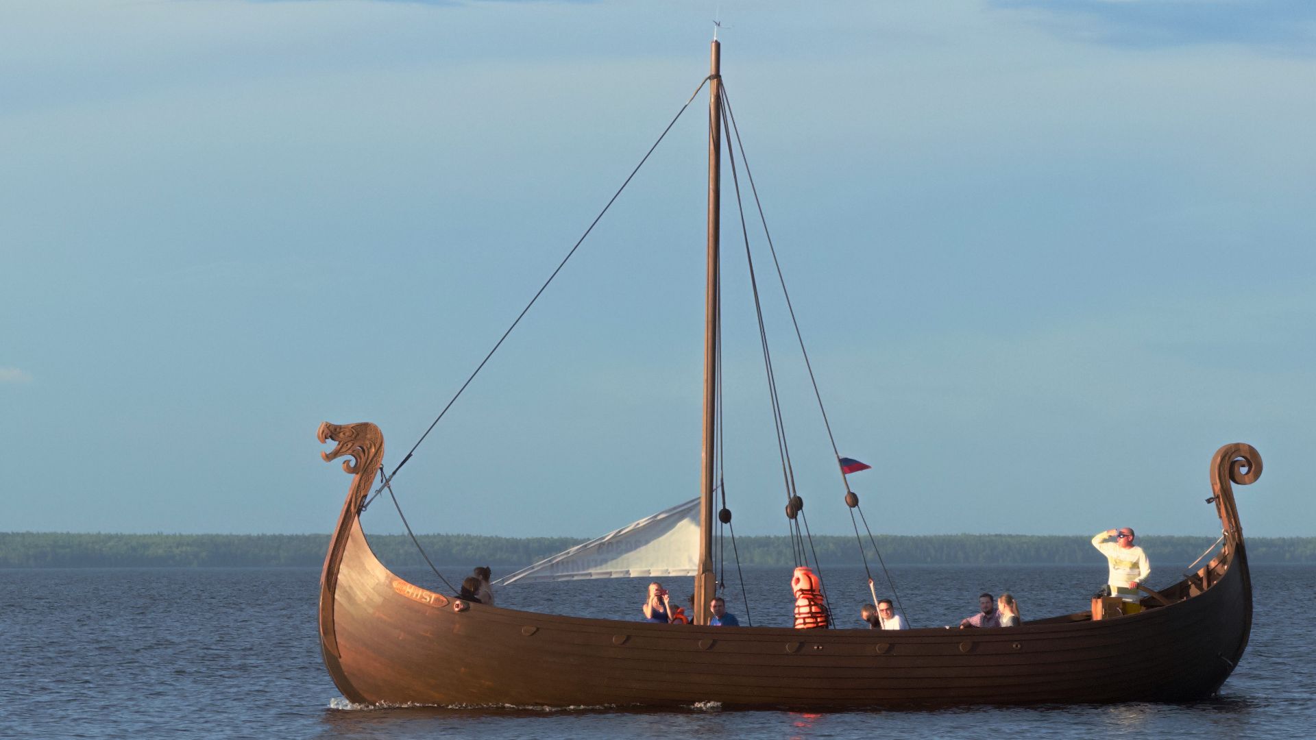 A boat floating on top of a large body of water