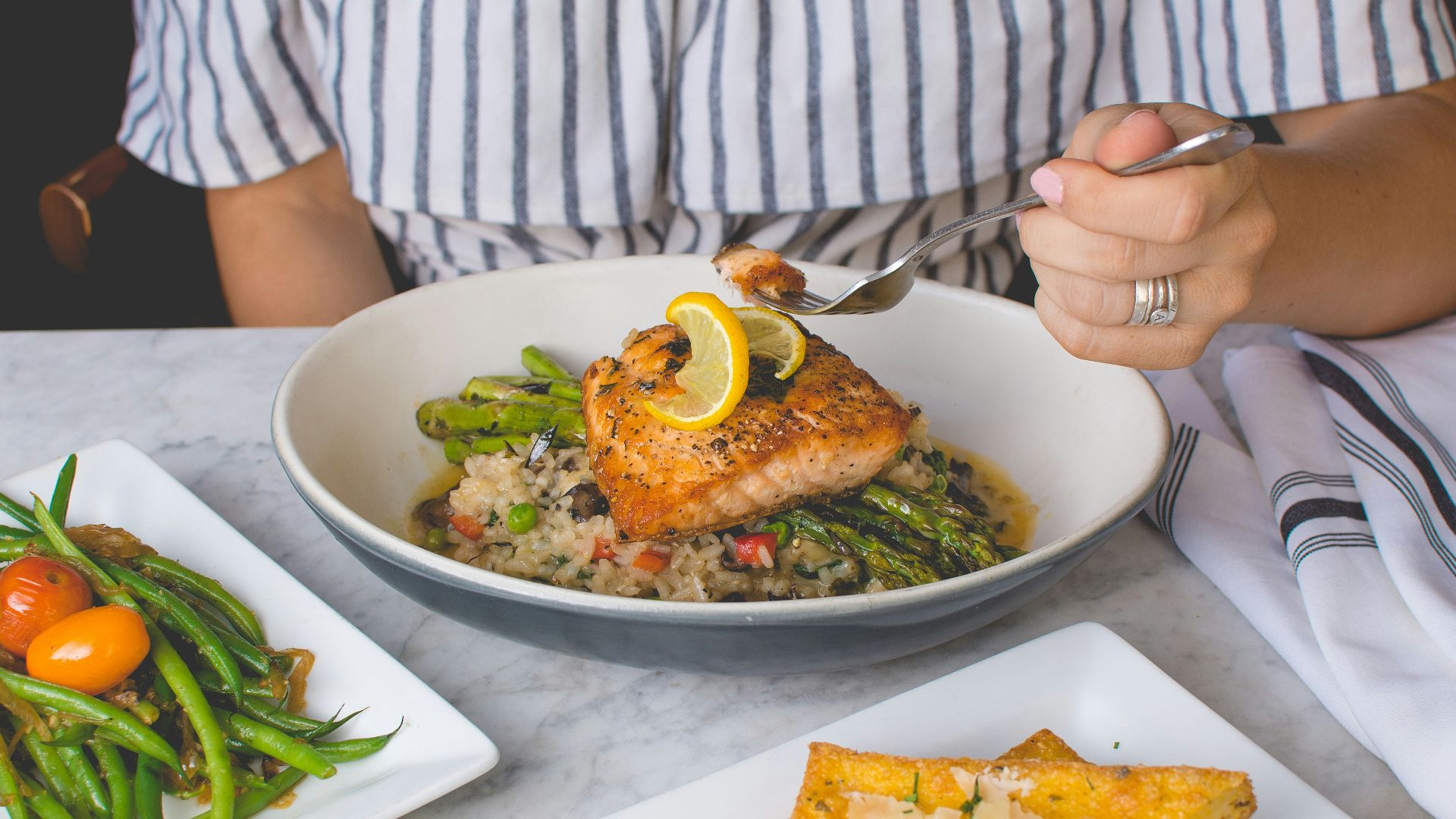 person eating fish meat