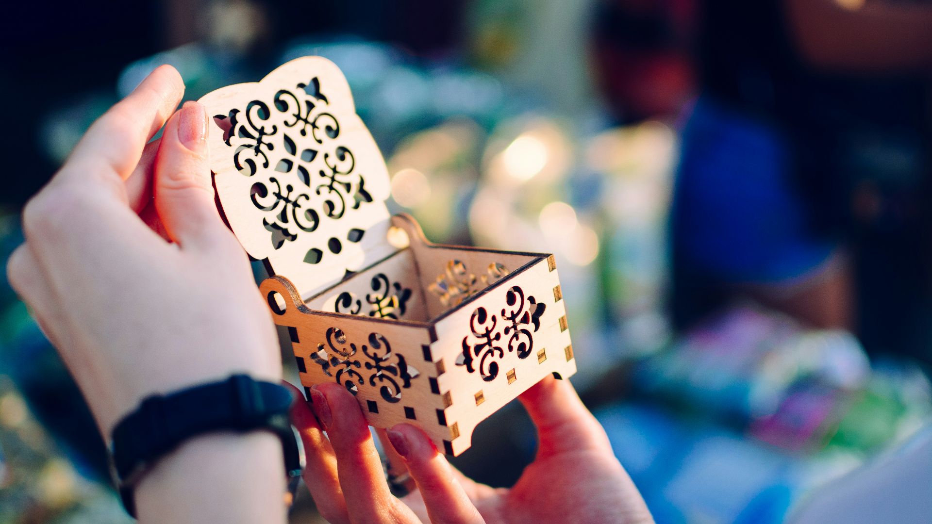 woman opens empty cut-out box