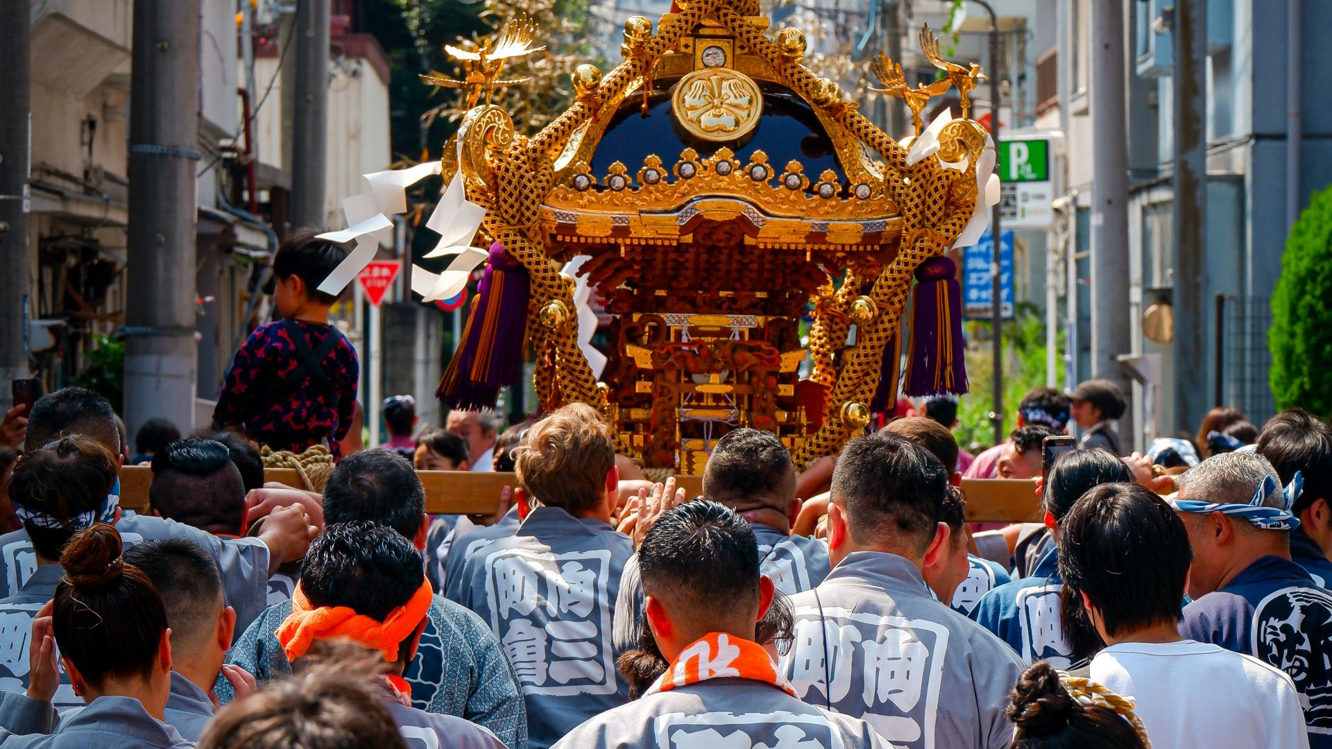 a large group of people walking down a street