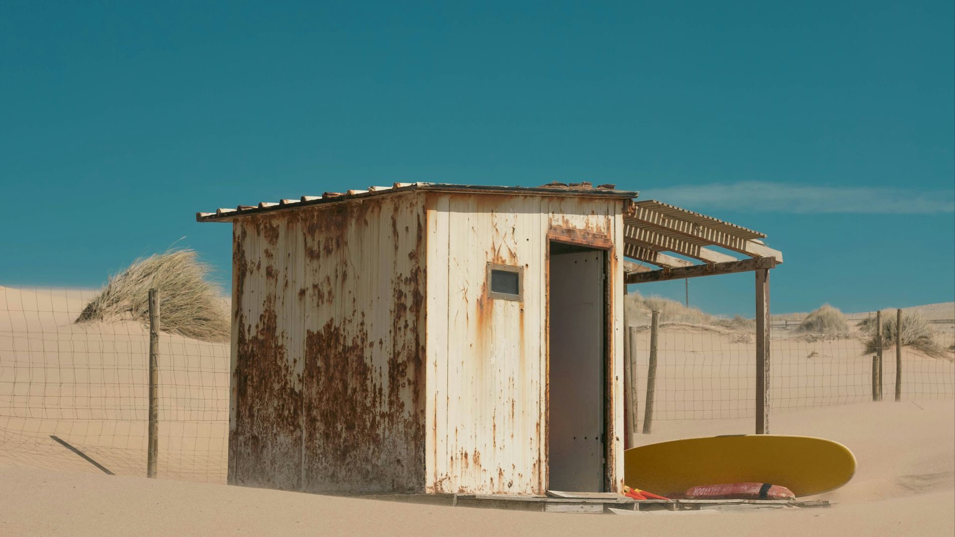 an outhouse in the middle of the desert