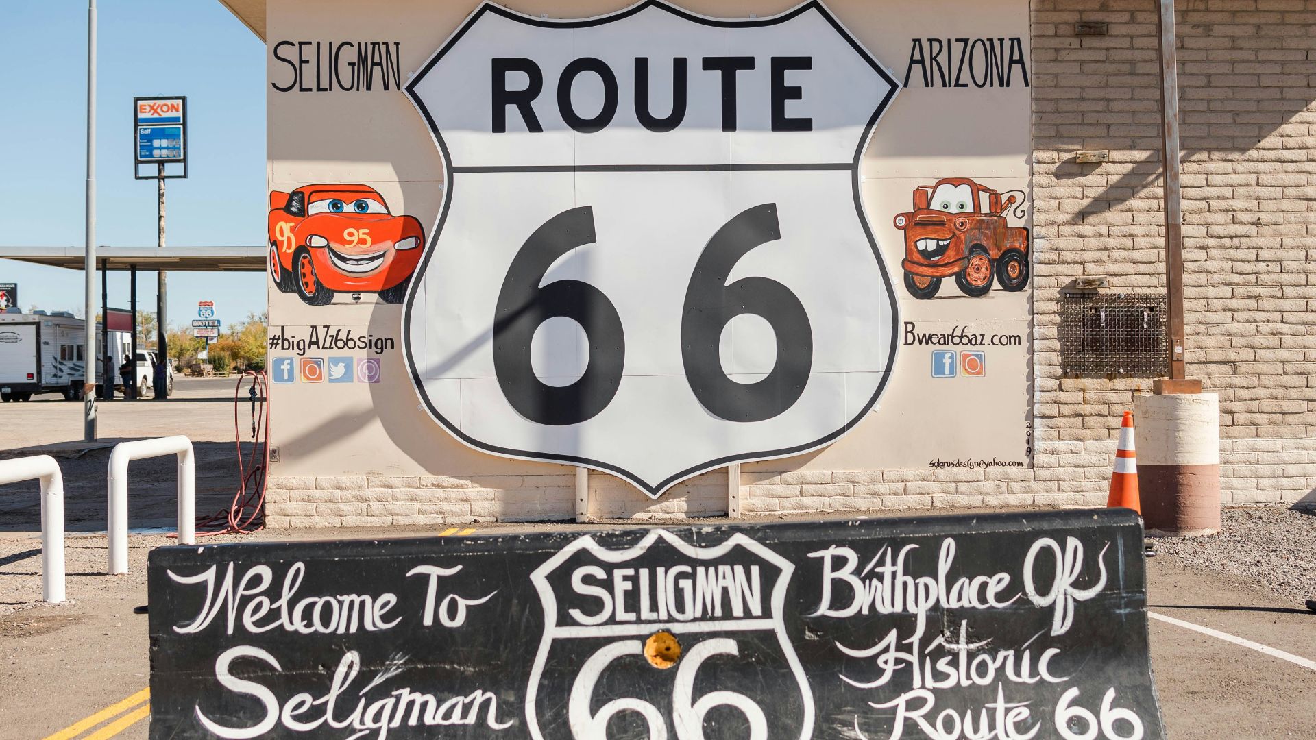 a route 66 sign in front of a building