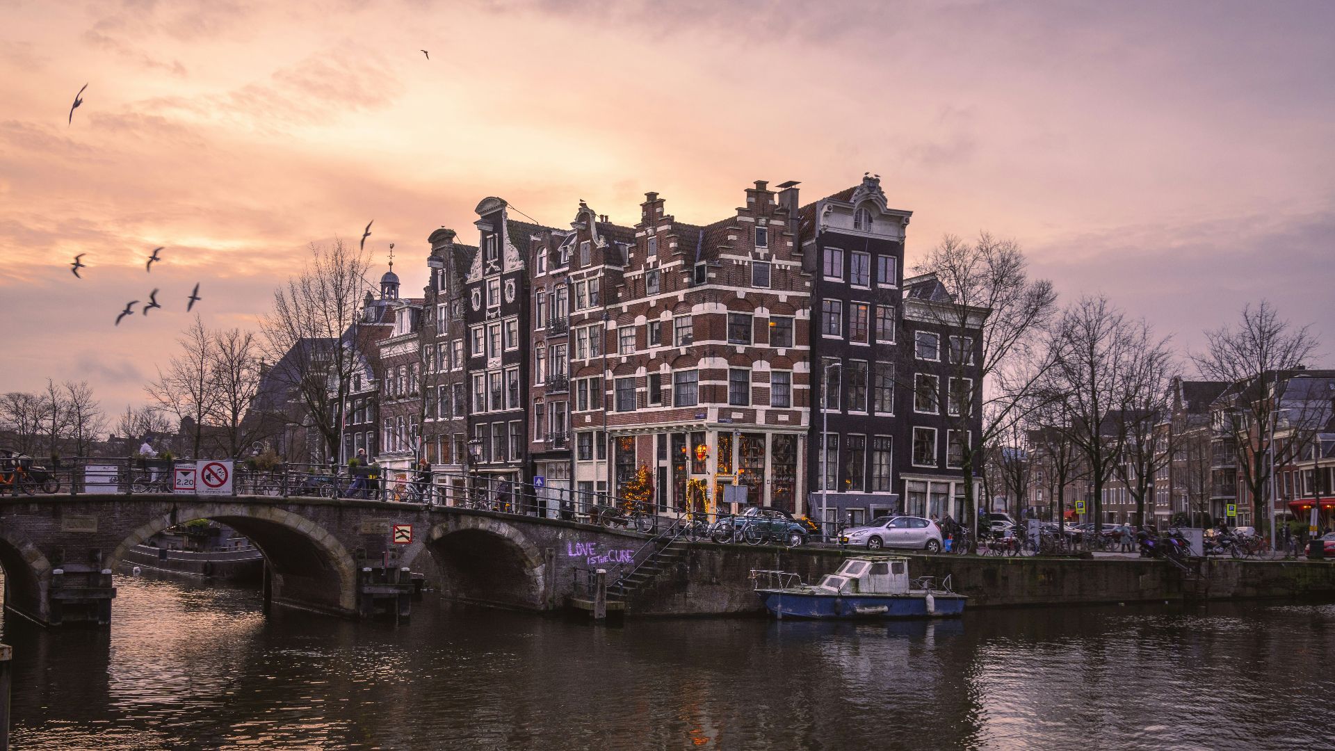 a bridge over a body of water with a boat on it