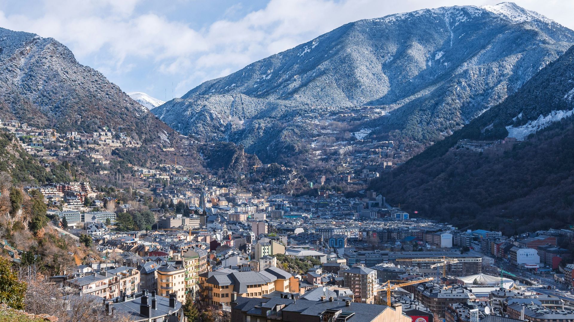 aerial view of city near mountain during daytime