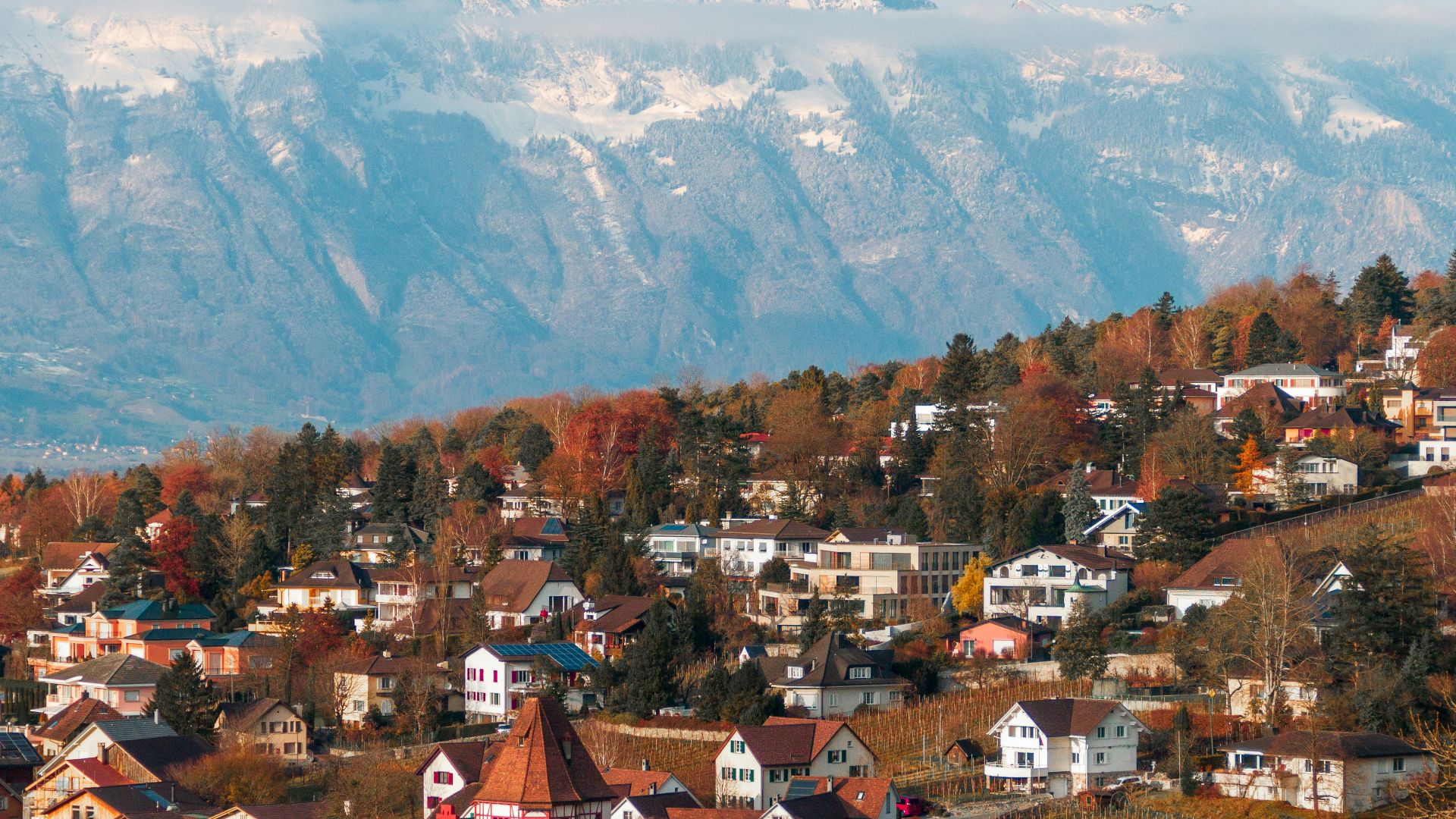 a town in front of a mountain