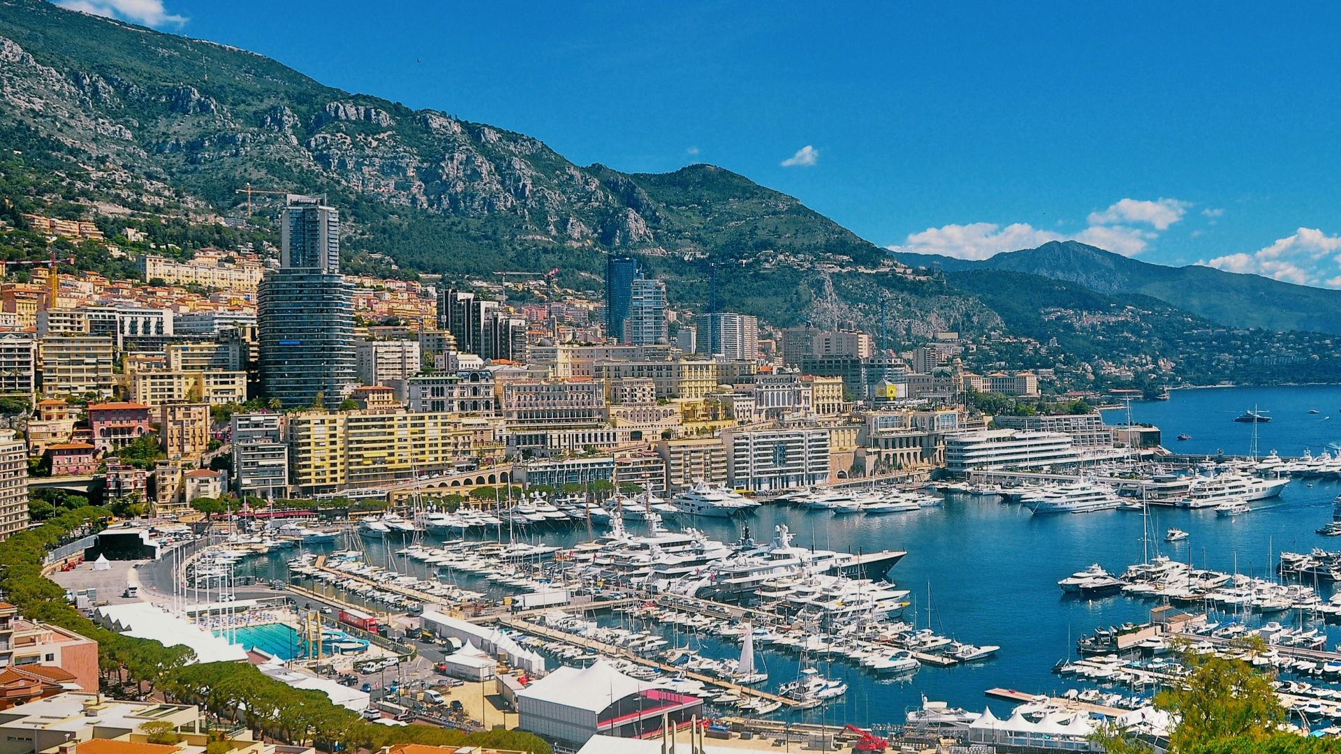 aerial view of city buildings near body of water during daytime