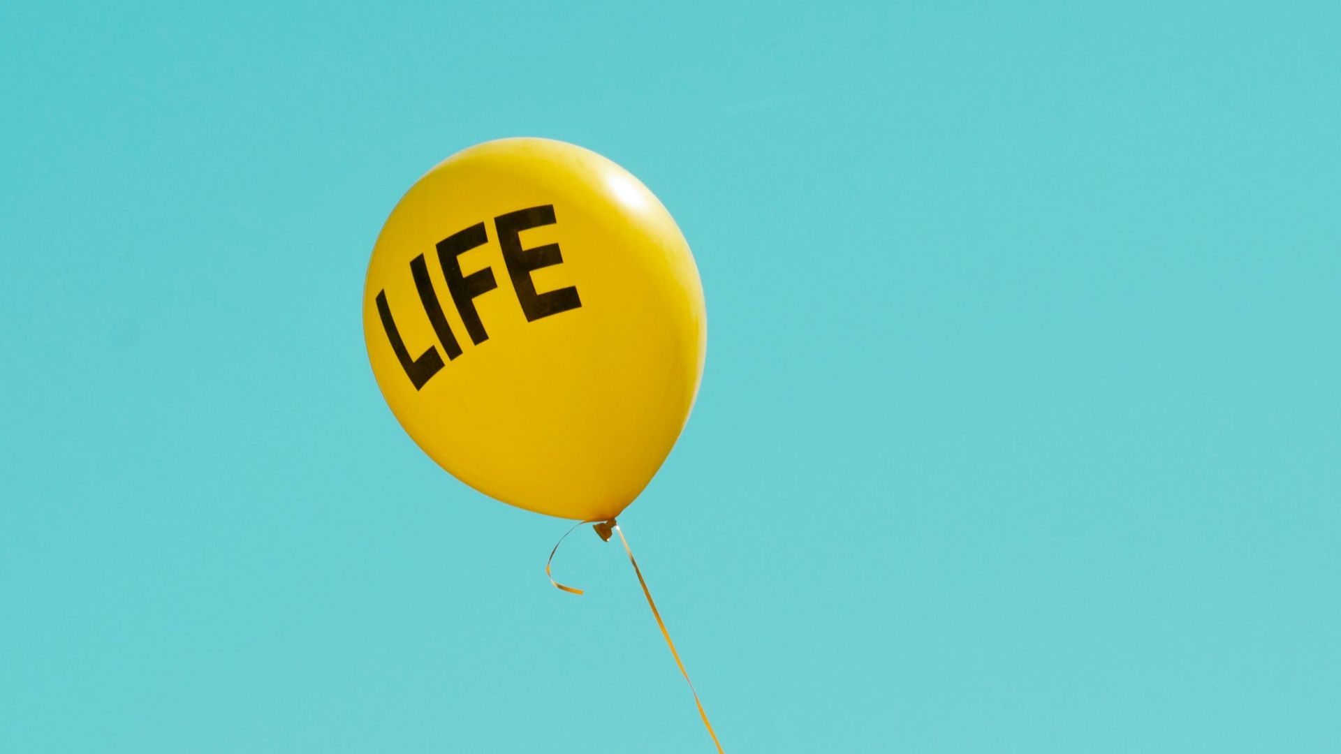 yellow life-printed balloon