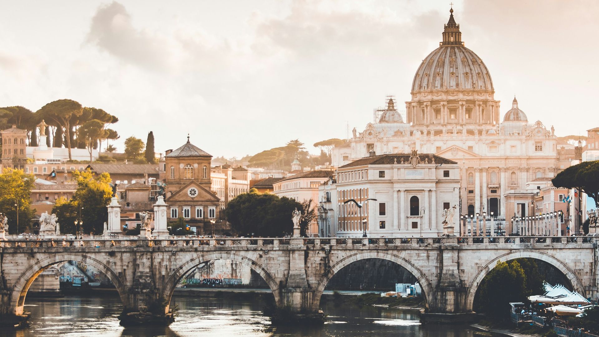 brown dome concrete building near bridge at daytime