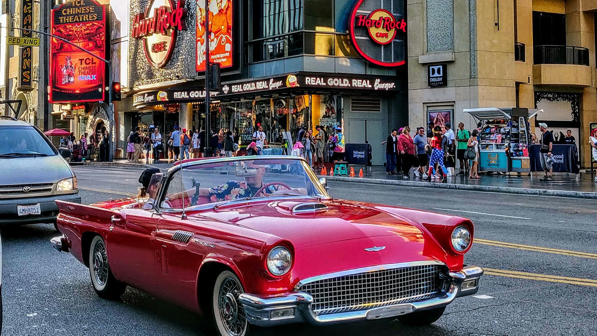 red convertible car on road during daytime