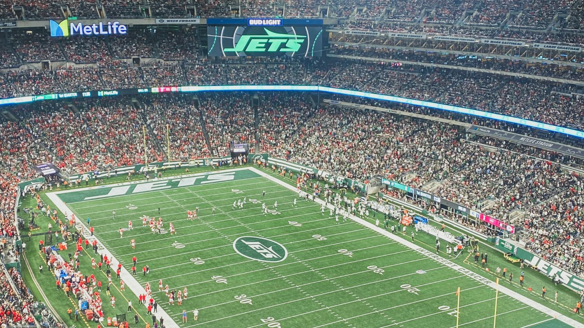 a stadium full of people watching a football game