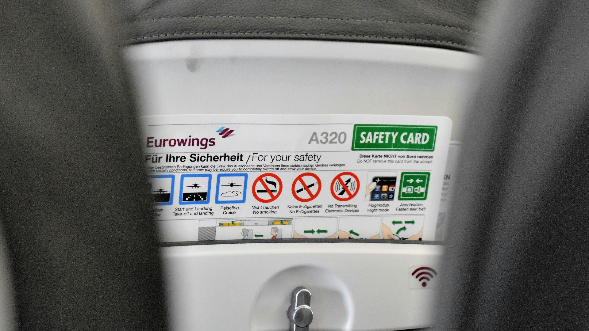 a close up of a seat with a button on it