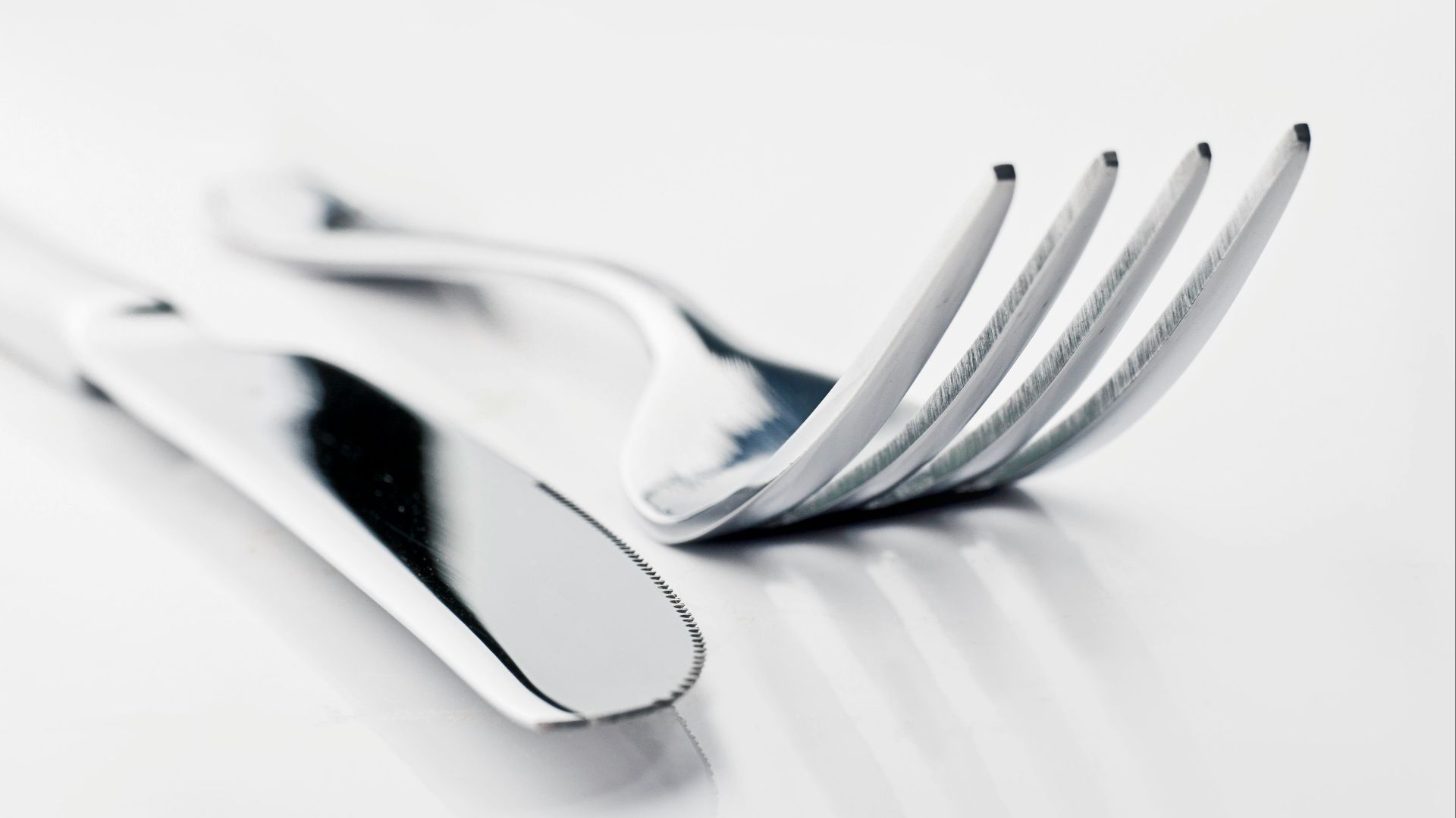 two silver bread knife and fork